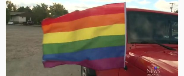 A Gay Pride flag flies from the vehicle in Chipman, N.B. CTV News screenshot, Oct. 23, 2018.