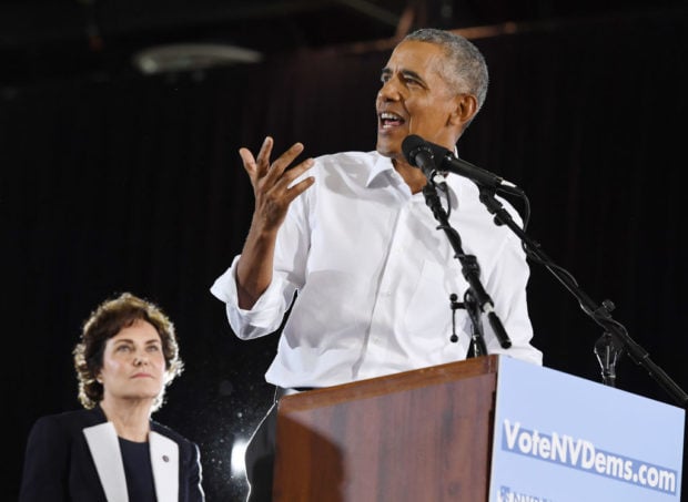 LAS VEGAS, NEVADA - OCTOBER 22: U.S. Rep. and U.S. Senate candidate Jacky Rosen (D-NV) (L) looks on as former U.S. President Barack Obama speaks during a get-out-the-vote rally at the Cox Pavilion as he campaigns for Nevada Democratic candidates on October 22, 2018 in Las Vegas, Nevada. (Ethan Miller/Getty Images)