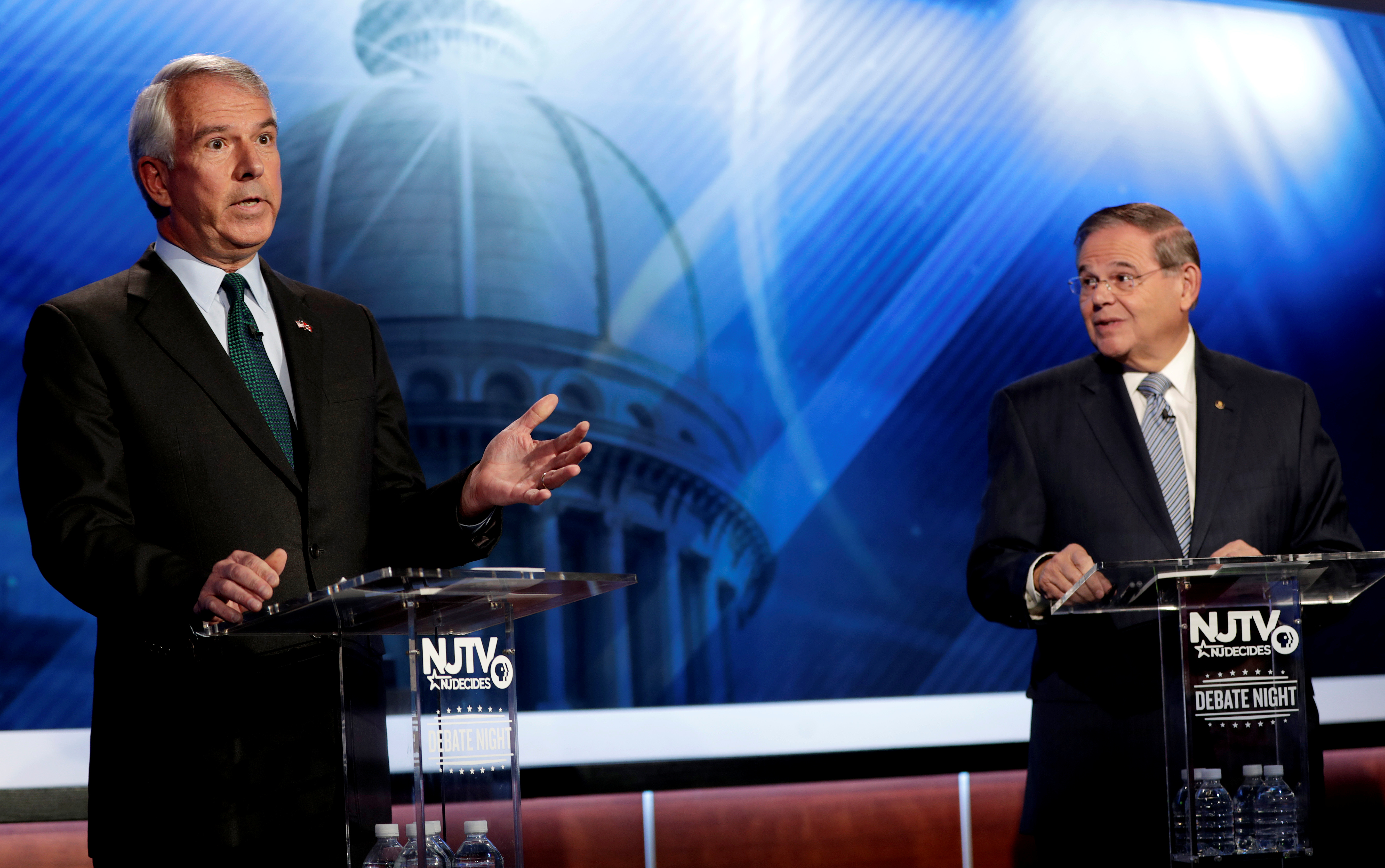 Bob Hugin, the Republican candidate for the U.S. Senate race in New Jersey, gestures as New Jersey Senator Bob Menendez, the Democrat candidate, looks on during a debate in Newark, New Jersey, U.S., October 24, 2018. Julio Cortez/Pool via Reuters