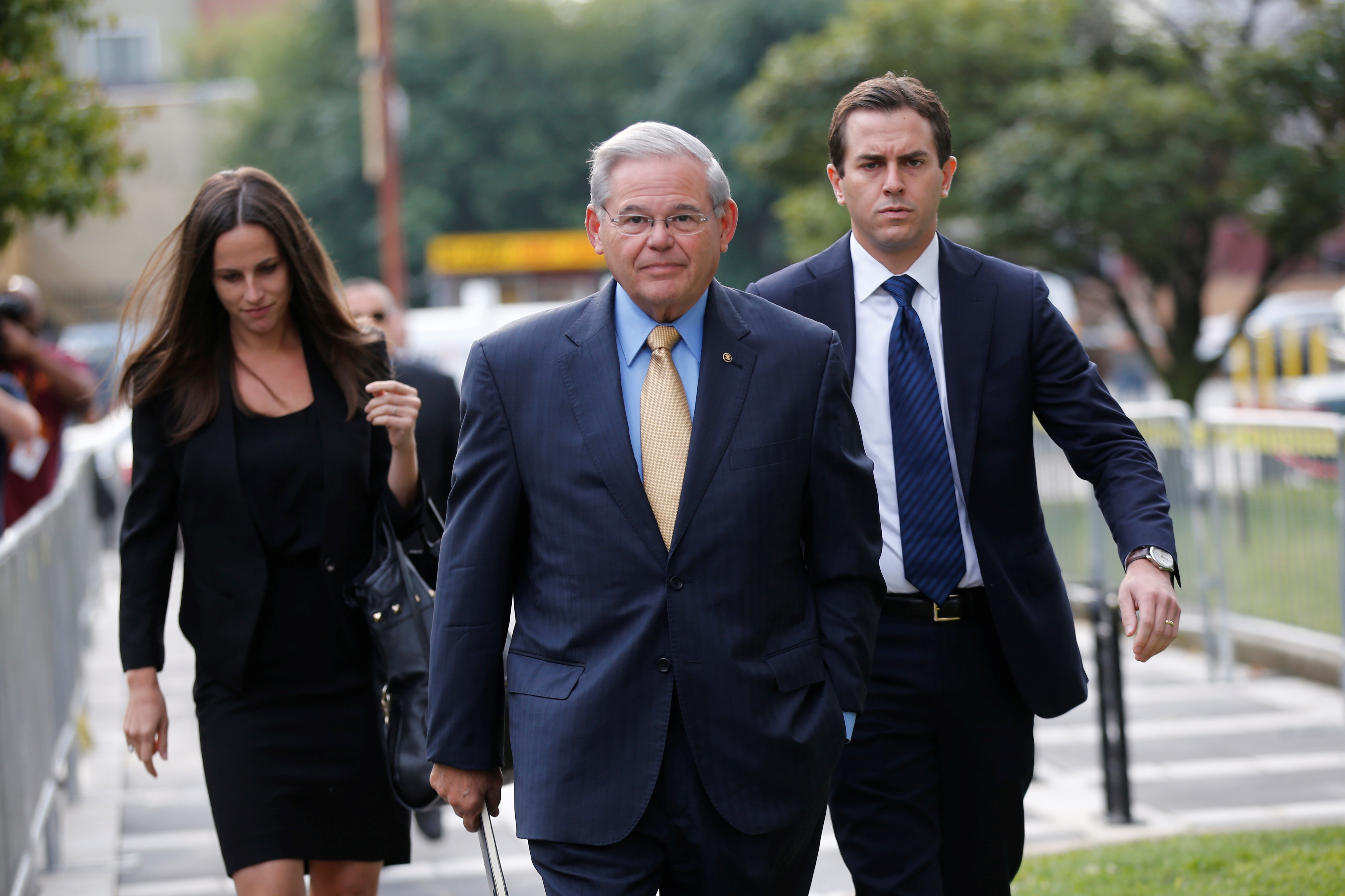 Senator Bob Menendez (C) arrives to face trial for federal corruption charges with his children Alicia Menendez (L) and Robert Melendez, Jr. (R) at United States District Court for the District of New Jersey in Newark, New Jersey, U.S., September 6, 2017. REUTERS/Joe Penney