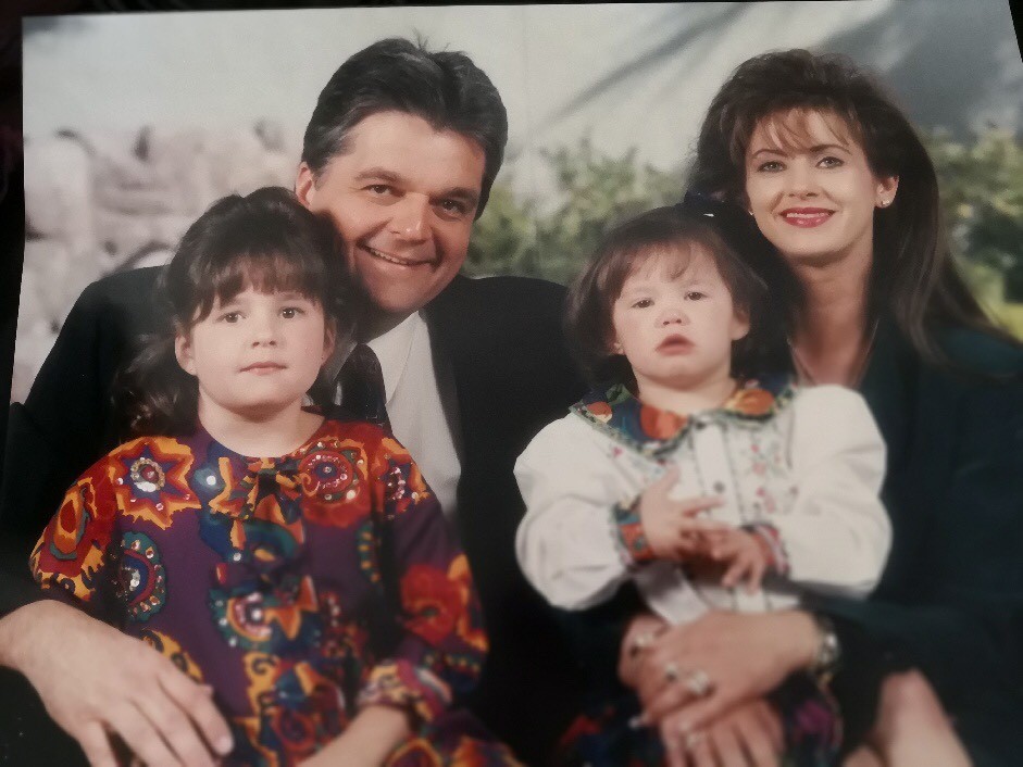 Sisolak family photo taken around 1993. Steve Sisolak on the left with Ashley Sisolak on his lap, and Dallas Sisolak on the right with Carley Sisolak on her lap. Courtesy Dallas Garland