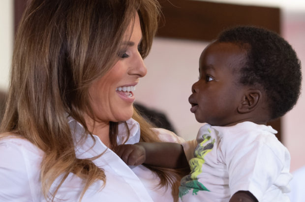 TOPSHOT - US First Lady Melania Trump (L) holds a baby as she visits the Nest Childrens Home Orphanage in Nairobi, on October 5, 2018, which primarily cares for children whose parents have been incarcerated. (Photo by SAUL LOEB / AFP) (Photo credit should read SAUL LOEB/AFP/Getty Images)