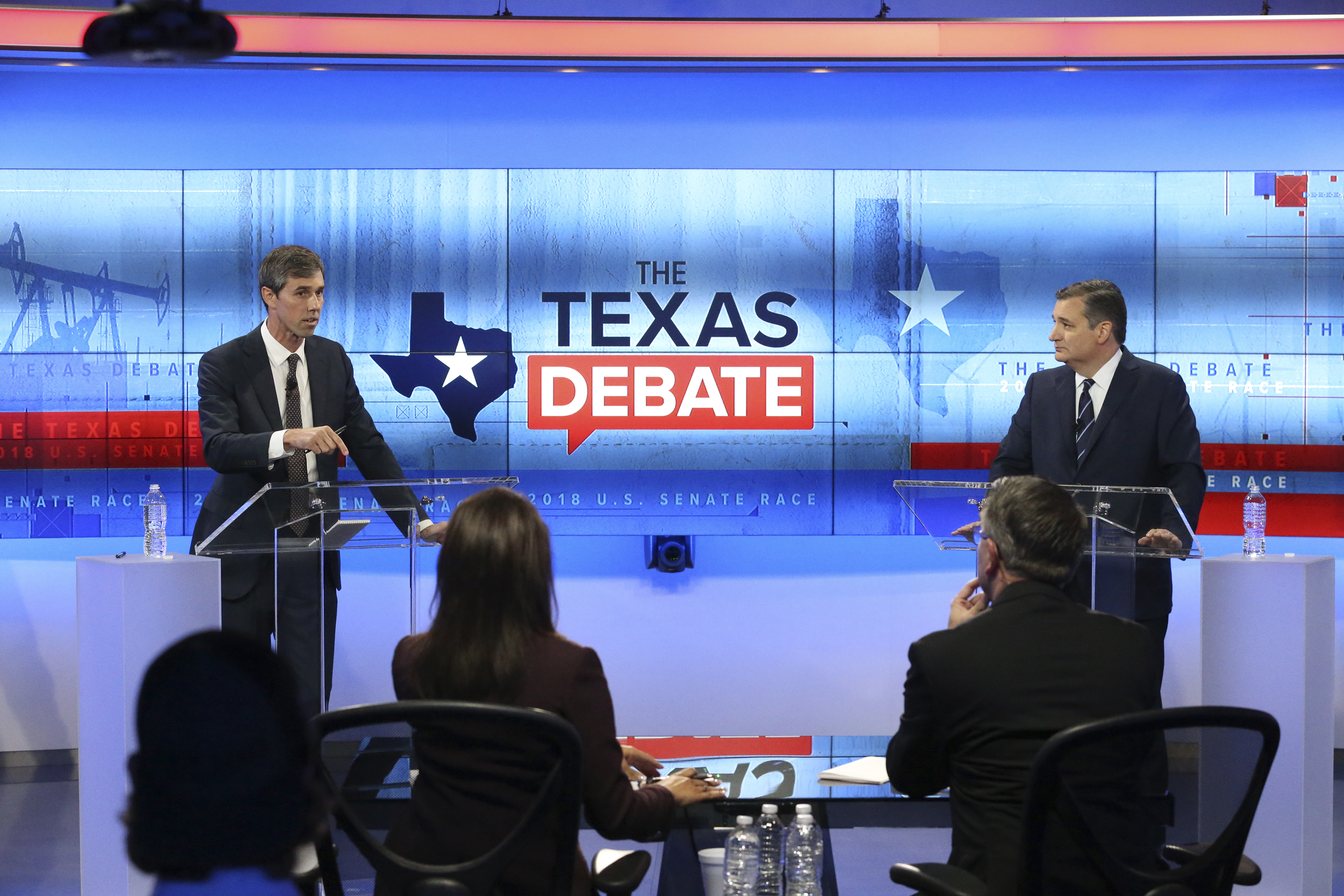 U.S. Rep. Beto O'Rourke (D-TX) (L) and U.S. Sen. Ted Cruz (R-TX) face off in a debate at the KENS 5 studios on October 16, 2018 in San Antonio, Texas. A recent poll show Cruz leading O'Rourke 52-45 percent among likely voters. Tom Reel-Pool/Getty Images