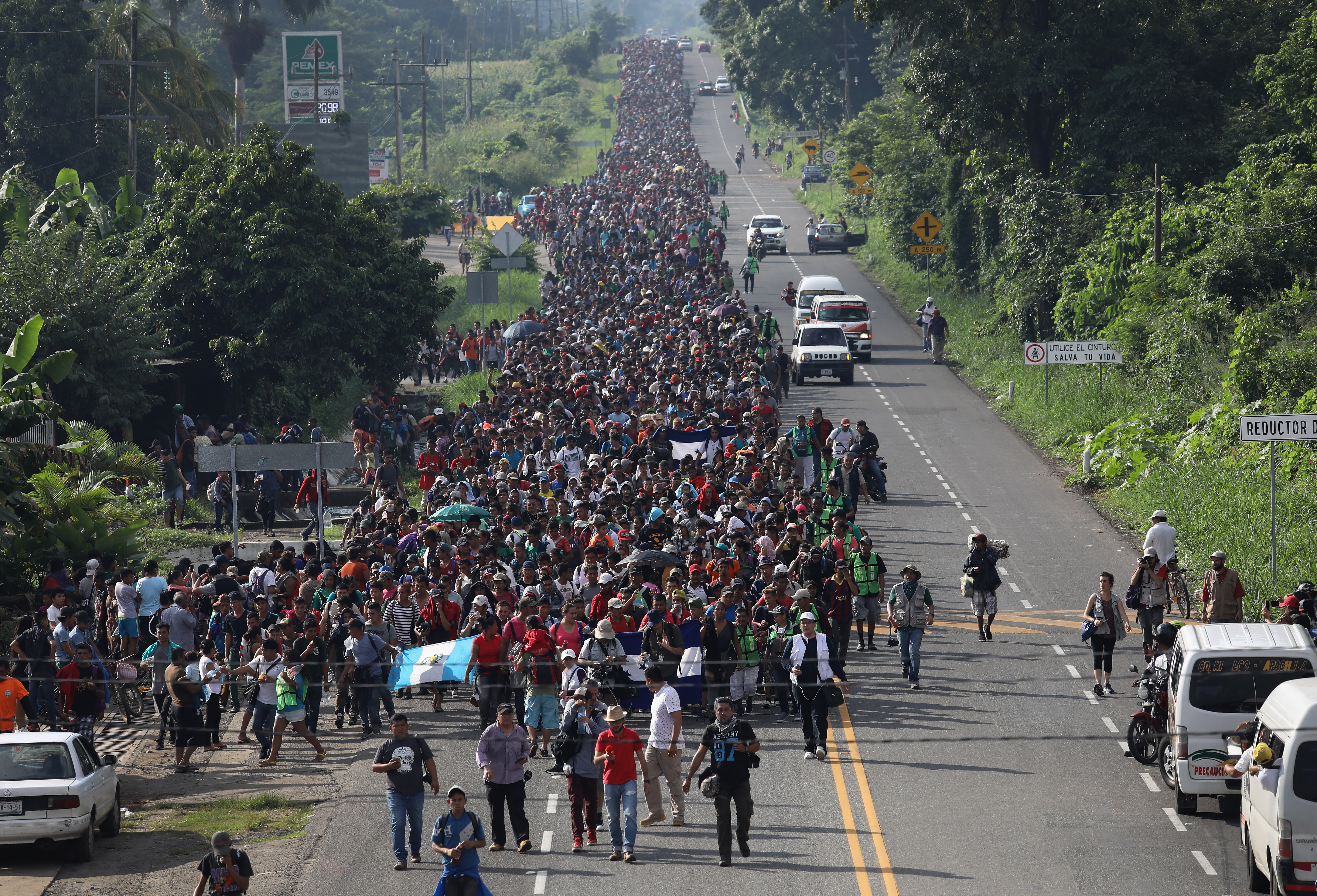 CIUDAD HIDALGO, MEXICO - OCTOBER 21: A migrant caravan, which has grown into the thousands, walks into the interior of Mexico after crossing the Guatemalan border on October 21, 2018 near Ciudad Hidalgo, Mexico The caravan of Central Americans plans to eventually reach the United States. U.S. President Donald Trump has threatened to cancel the recent trade deal with Mexico and withhold aid to Central American countries if the caravan isn't stopped before reaching the U.S. (Photo by John Moore/Getty Images)