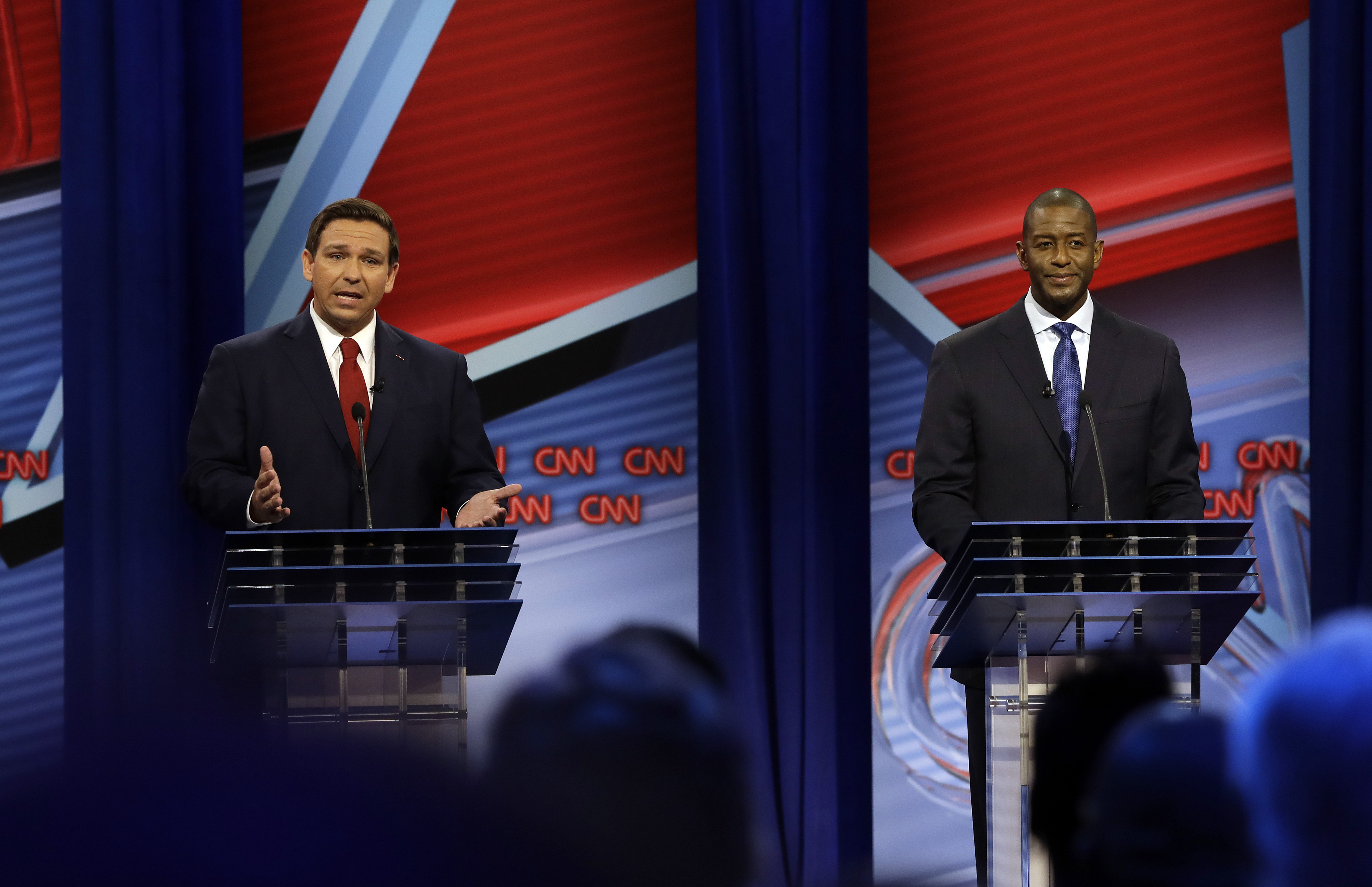 TAMPA, FLORIDA - OCTOBER 21: Florida Republican gubernatorial candidate Ron DeSantis, left, speaks about his Democratic opponent Andrew Gillum during a CNN debate, Sunday, Oct. 21, 2018, in Tampa, Fla. (Photo by Chris O'Meara-Pool/Getty Images)