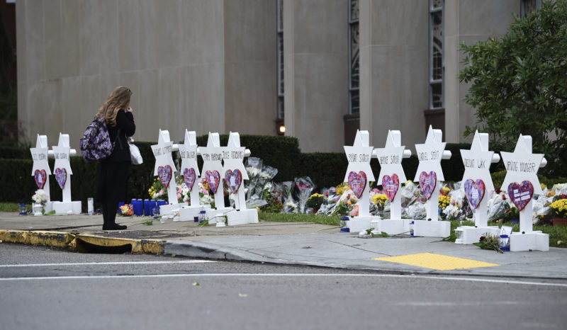 A woman stands at a memorial outside the Tree of Life synagogue after a shooting there left 11 people dead in the Squirrel Hill neighborhood of Pittsburgh on October 27. BRENDAN SMIALOWSKI/AFP/Getty Images