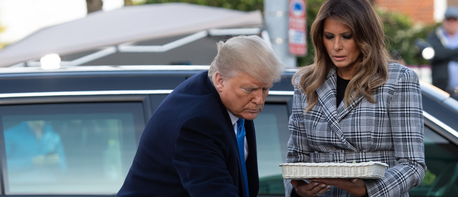 US President Donald Trump and First Lady Melania Trump place stones and flowers on a memorial as they pay their respects at the Tree of Life Synagogue in Pittsburgh, Pennsylvania, October 30, 2018. (Photo: SAUL LOEB/AFP/Getty Images)
