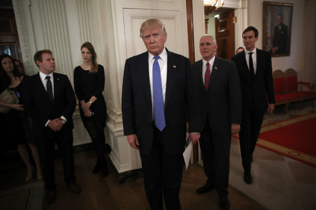 WASHINGTON, DC - FEBRUARY 23: U.S. President Donald Trump (C) waits to be introduced with U.S. Vice President Mike Pence (2nd R) and senior advisor to the President Jared Kushner (R) before Trump participated in a listening session with manufacturing CEOs in the State Dining Room of the White House February 23, 2017 in Washington, DC. Trump met with the CEOs in an effort to develop beneficial new policies on taxes, trade and job creation. Also pictured is Kenneth Frazier (R) CEO of Merck & Company. (Photo by Win McNamee/Getty Images)