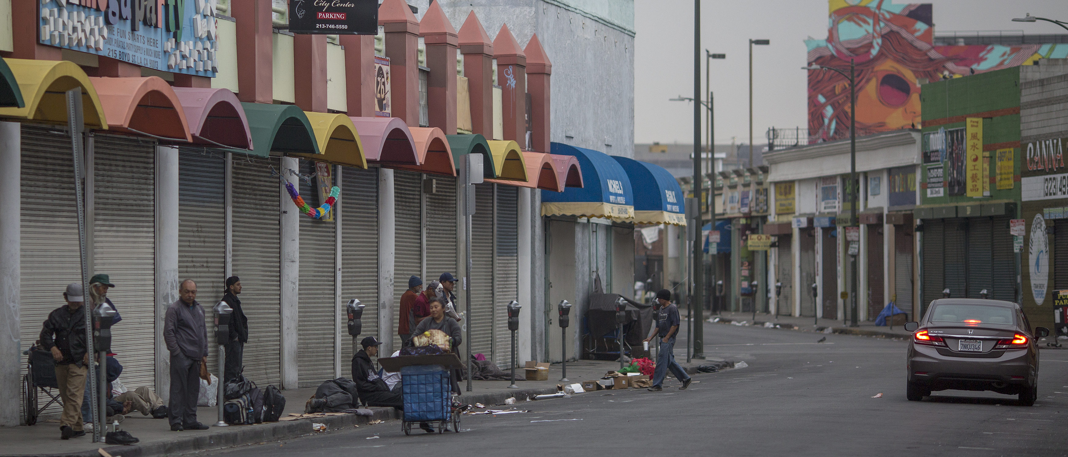 LOS ANGELES, CA - JUNE 01: Homeless people mill around on a Skid Row sidewalk after packing up their tents for the day and before businesses open on May 1, 2017 in Los Angeles, California. The newly released 2017 Greater Los Angeles Homeless Count indicates a 20 percent jump in the city of Los Angeles while Los Angeles County has spiked 23 percent. Voters have approved a record number of funds for homeless services with the passage of Measure HHH in the city and Measure H countywide. (Photo by David McNew/Getty Images)