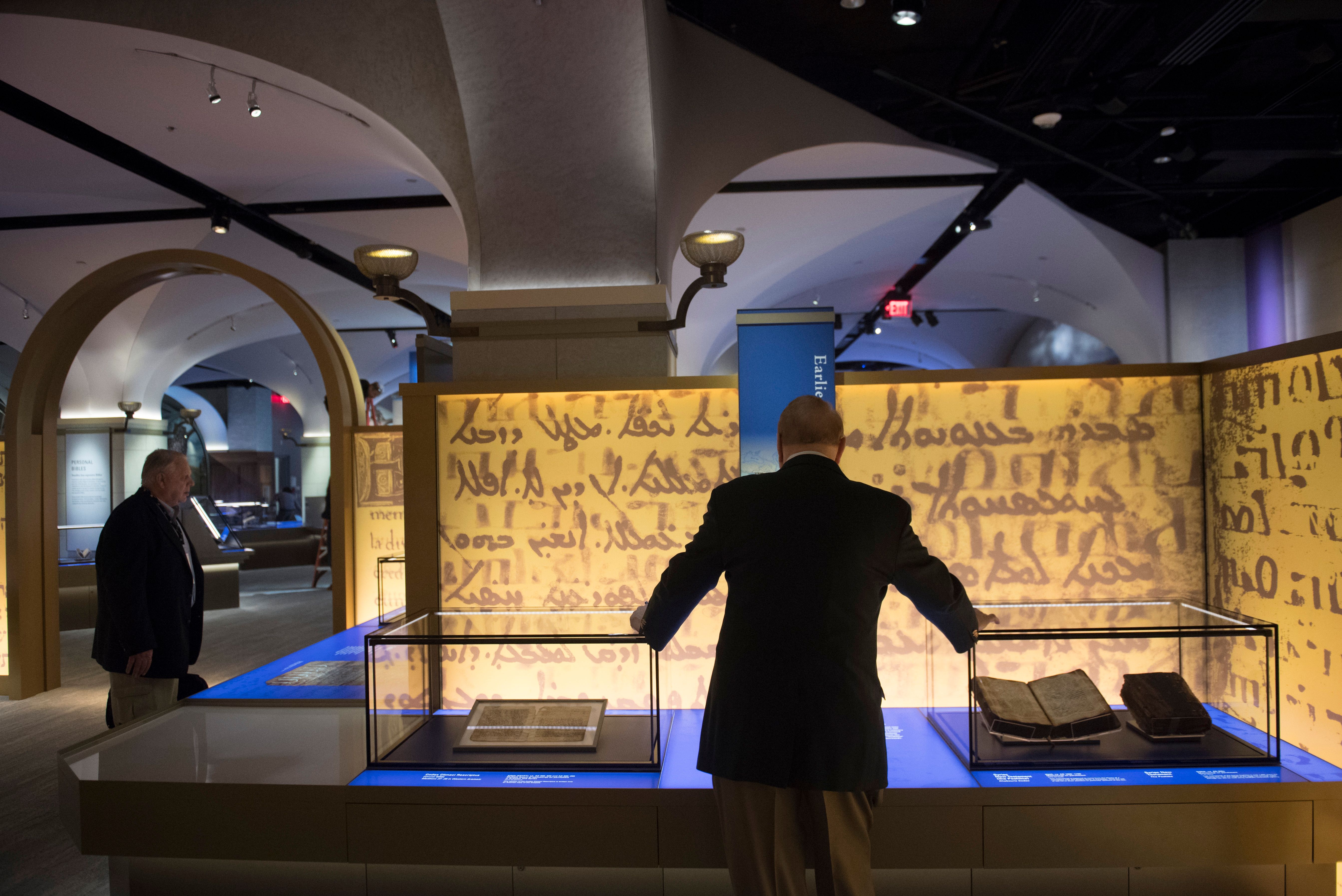 Visitors tour the "History of the Bible" exhibit during a media preview of the new Museum of the Bible, a museum dedicated to the history, narrative and impact of the Bible, in Washington, DC, November 14, 2017. SAUL LOEB/AFP/Getty Images