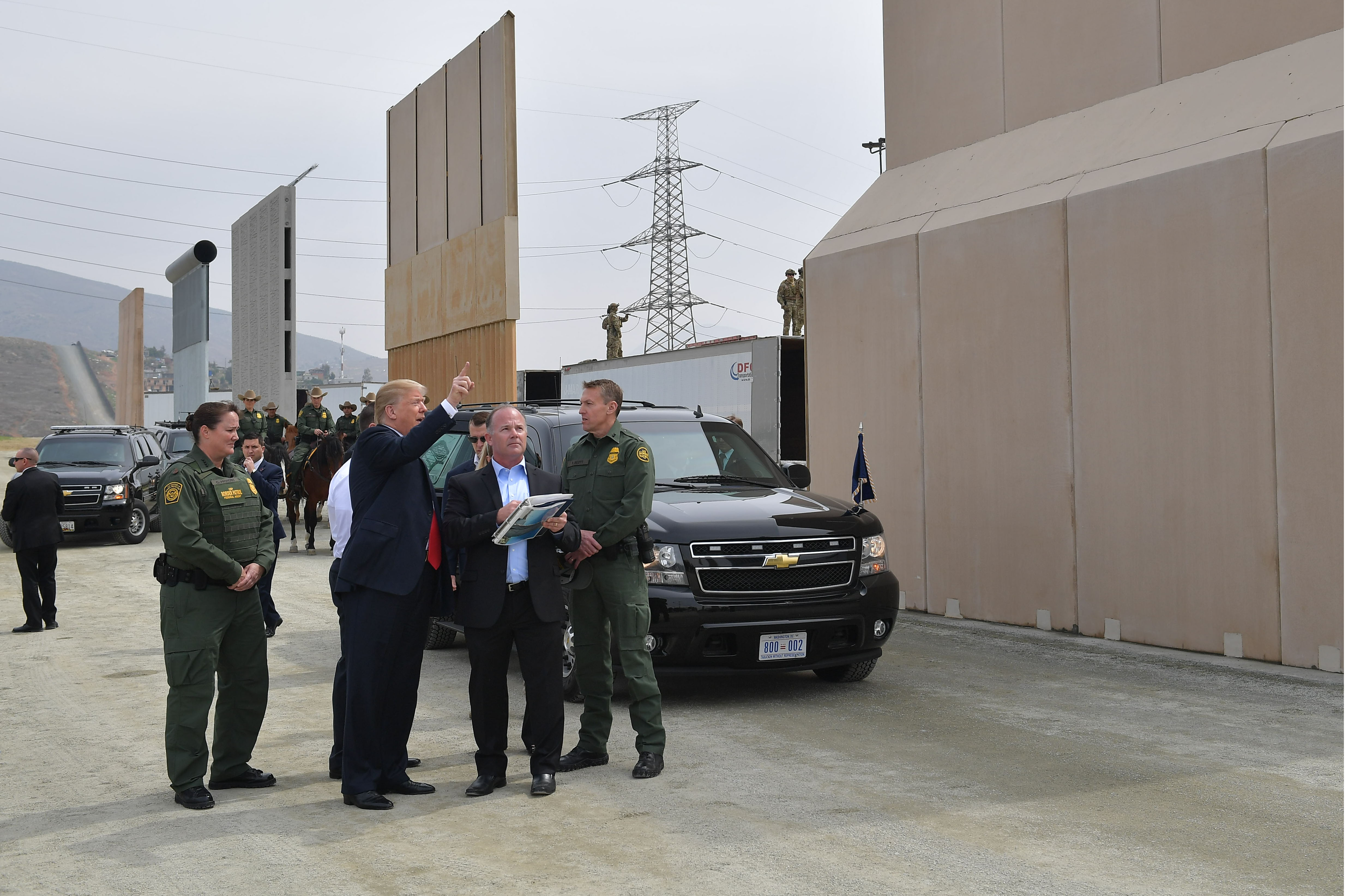 US President Donald Trump is shown border wall prototypes in San Diego, California on March 13, 2018. / AFP PHOTO / MANDEL NGAN (Photo credit should read MANDEL NGAN/AFP/Getty Images)