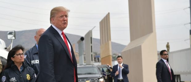 US President Donald Trump inspects border wall prototypes in San Diego, California on March 13, 2018. (Photo credit should read MANDEL NGAN/AFP/Getty Images)