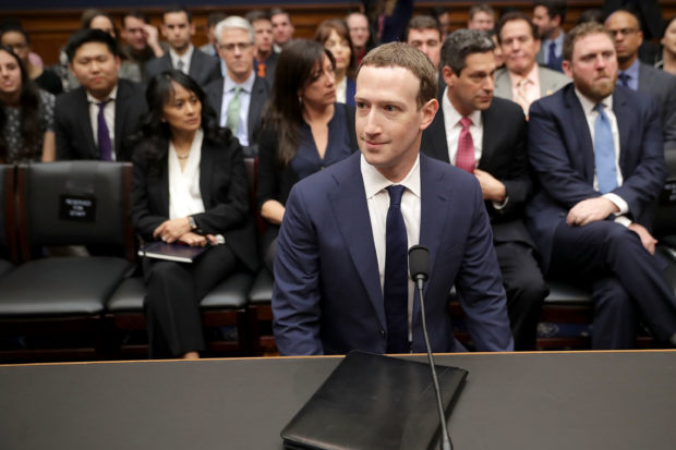 WASHINGTON, DC - APRIL 11: Facebook co-founder, Chairman and CEO Mark Zuckerberg prepares to testify before the House Energy and Commerce Committee in the Rayburn House Office Building on Capitol Hill April 11, 2018 in Washington, DC. This is the second day of testimony before Congress by Zuckerberg, 33, after it was reported that 87 million Facebook users had their personal information harvested by Cambridge Analytica, a British political consulting firm linked to the Trump campaign. (Photo by Chip Somodevilla/Getty Images)