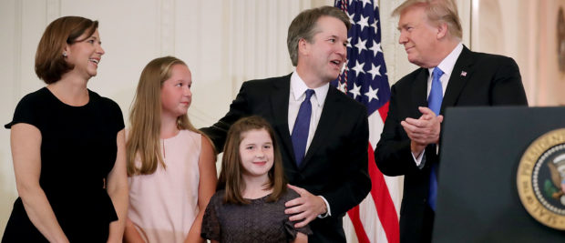 WASHINGTON, DC - JULY 09: U.S. President Donald Trump (R), Judge Brett M. Kavanaugh (2nd R), his wife Ashley Estes Kavanaugh and their daughters, Margaret and Liza, stand on stage after Trump announced the judge as his nominee to the United States Supreme Court during an event in the East Room of the White House July 9, 2018 in Washington, DC. Pending confirmation by the U.S. Senate, Kavanaugh would succeed Associate Justice Anthony Kennedy, 81, who is retiring after 30 years of service on the high court. (Photo by Chip Somodevilla/Getty Images)