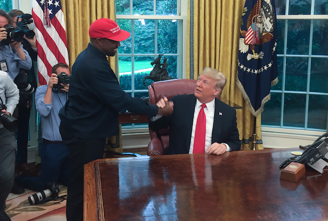 US President Donald Trump meets with rapper Kanye West in the Oval Office of the White House in Washington, DC, October 11, 2018. (Photo credit: SEBASTIAN SMITH/AFP/Getty Images)