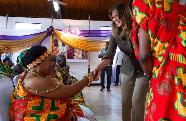 US First Lady Melania Trump greets a receiving line at the Emintsimadze palace in Cape Coast, Ghana, October 3, 2018. - US First Lady Melania Trump is on a solo tour of Africa to promote her children's welfare programme. (Photo credit: SAUL LOEB/AFP/Getty Images)