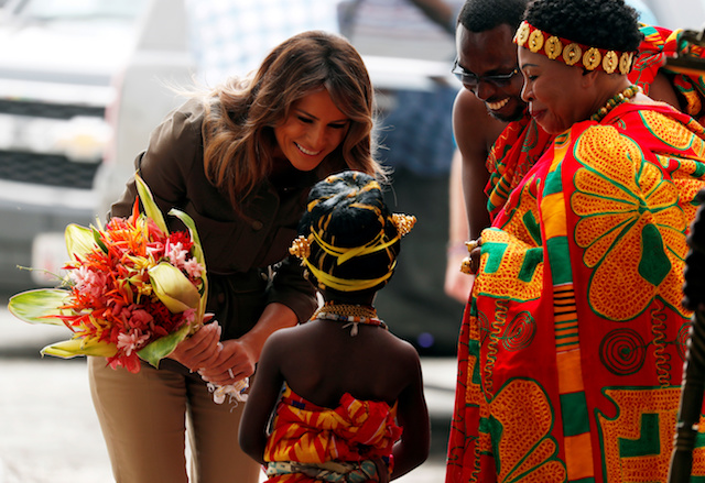 U.S. first lady Melania Trump greets a child during her visit at Cape Coast castle, Ghana, October 3, 2018. REUTERS/Carlo Allegri