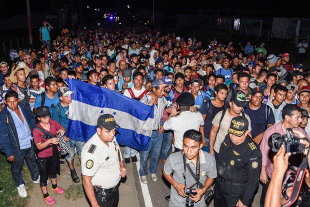 Honduran migrants taking part in a new caravan heading to the US, arrive to Chiquimula, Guatemala, on October 22, 2018. - US President Donald Trump on Monday called the migrant caravan heading toward the US-Mexico border a national emergency, saying he has alerted the US border patrol and military. ORLANDO ESTRADA/AFP/Getty Images