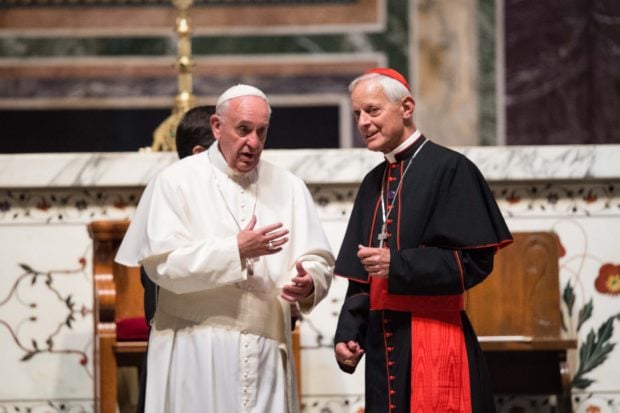 Pope Francis (L) speaks speaks with the Archbishop of Washington Cardinal Donald Wuerl at the end of a midday prayer with US bishops at the Cathedral of St. Matthew the Apostle in Washington, DC, on September 23, 2015. (NICHOLAS KAMM/AFP/Getty Images)