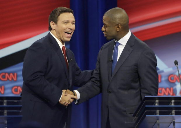 TAMPA, FLORIDA - OCTOBER 21: Florida Republican gubernatorial candidate Ron DeSantis, left, shakes hands with Democratic gubernatorial candidate Andrew Gillum after a CNN debate, Sunday, Oct. 21, 2018, in Tampa, Fla. (Photo by Chris O'Meara-Pool/Getty Images)