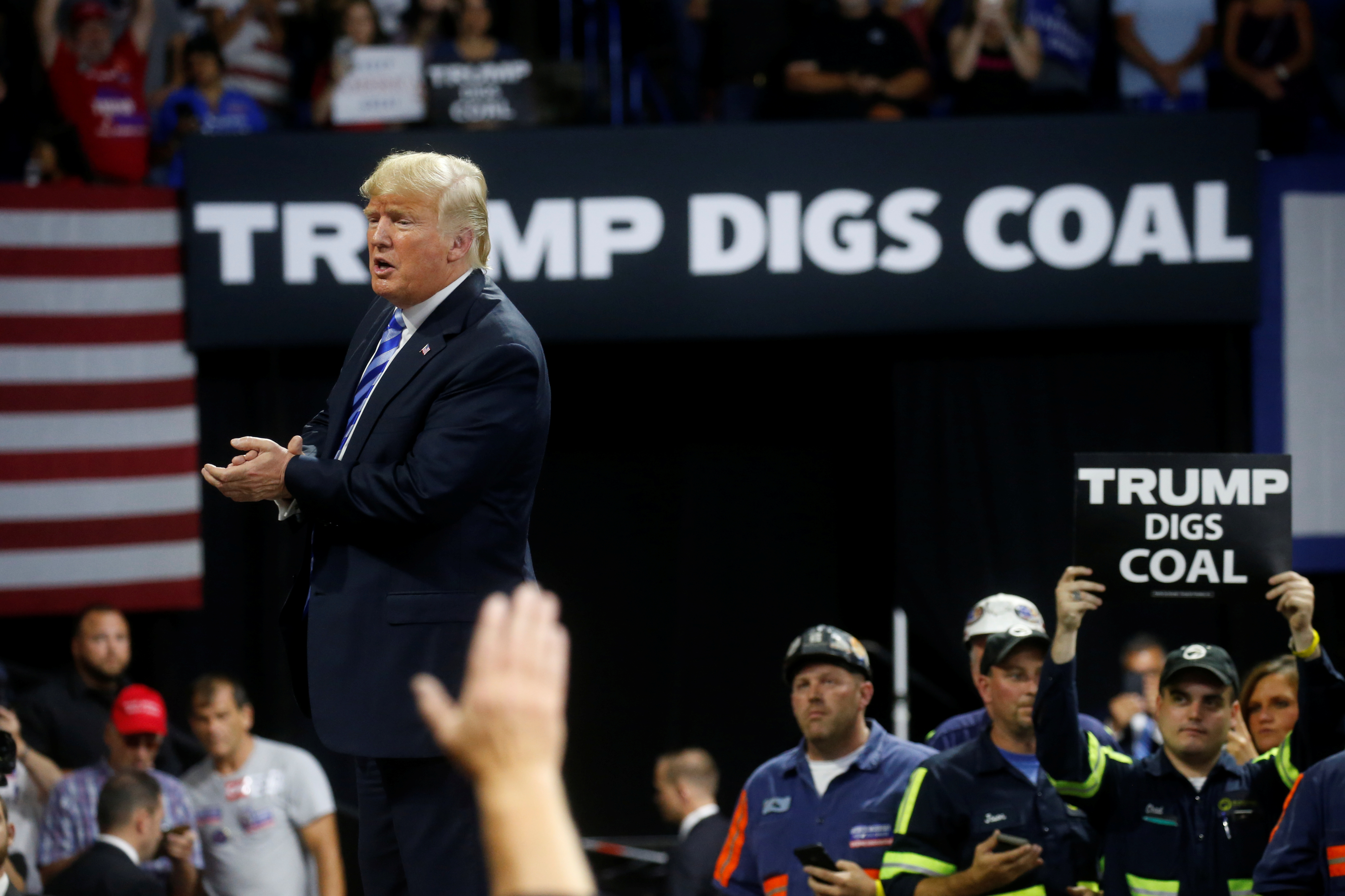 U.S. President Donald Trump acknowledges coal miners during a Make America Great Again rally at the Civic Center in Charleston