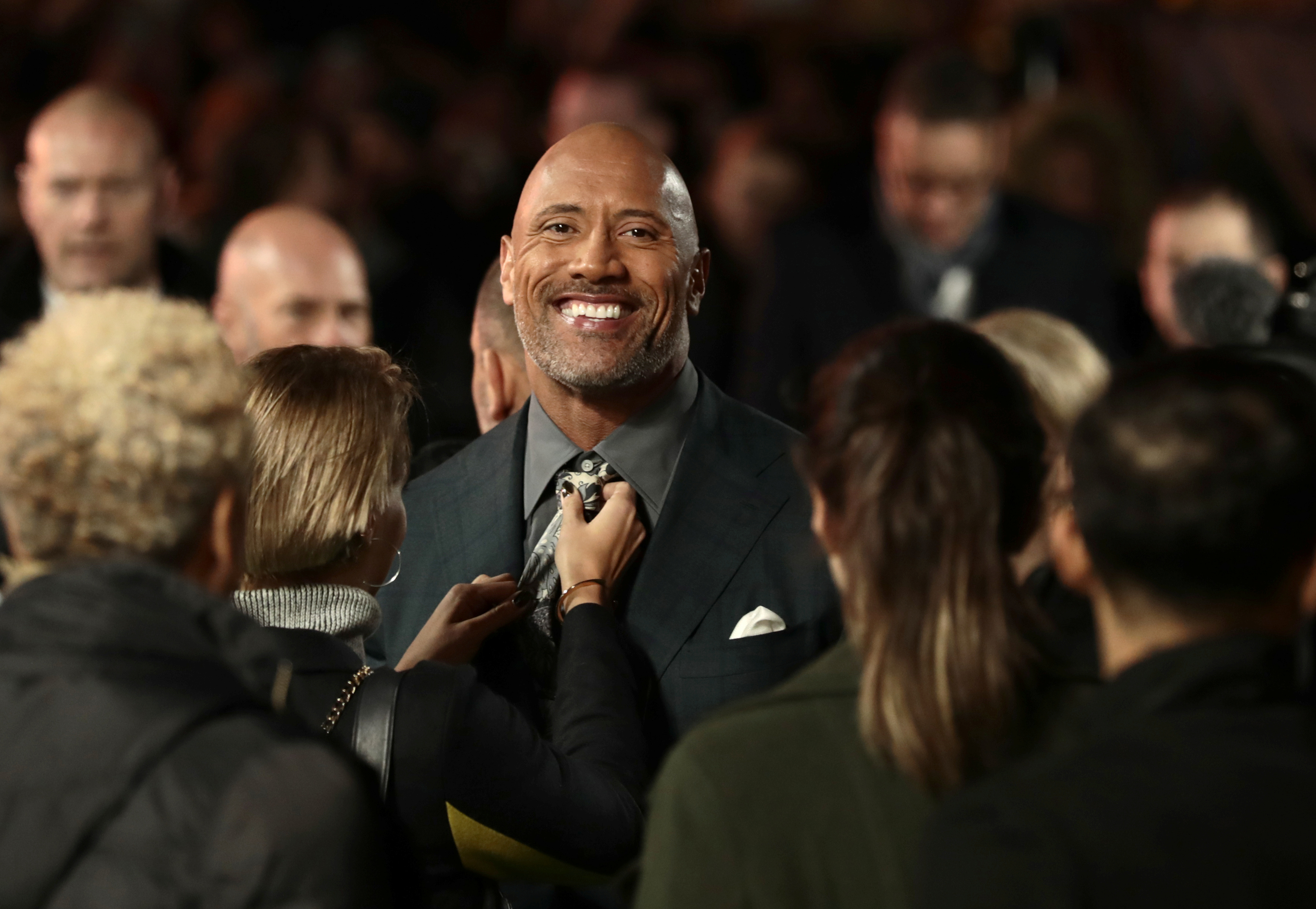Actor Dwayne Johnson prepares to pose for photographers as he arrives for the UK premiere of 'Jumanji: Welcome to the Jungle', at the Vue West End, Leicester Square, central London, Britain December 7, 2017. REUTERS/Simon Dawson 