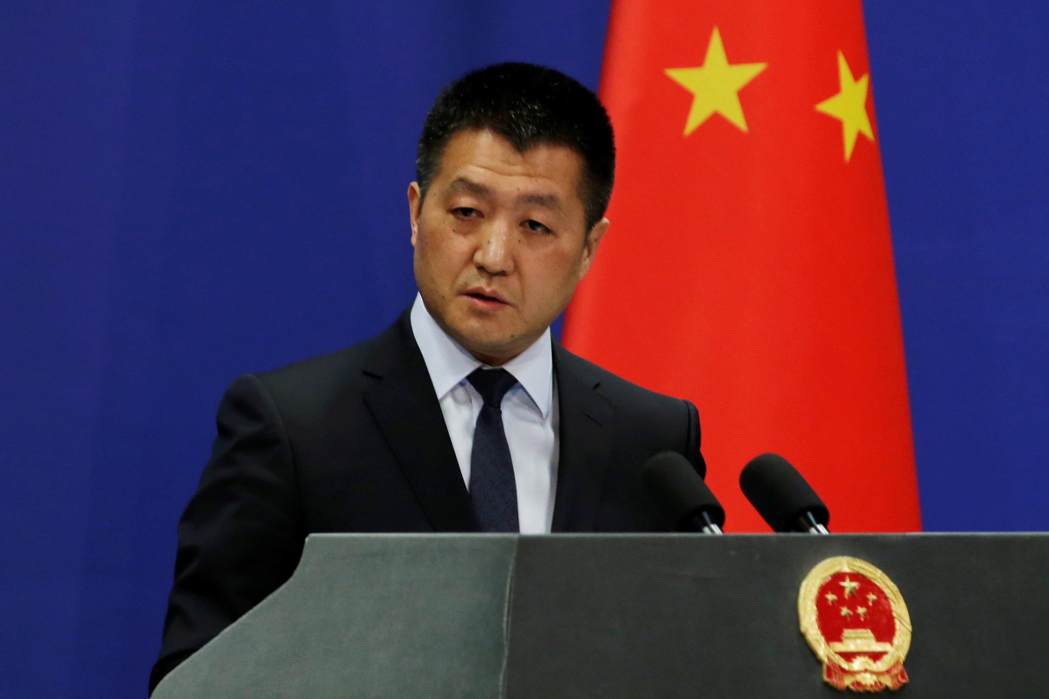 Chinese Foreign Ministry spokesman Lu Kang answers questions about a major bus accident in North Korea, during a news conference in Beijing, China April 23, 2018. REUTERS/Jason Lee
