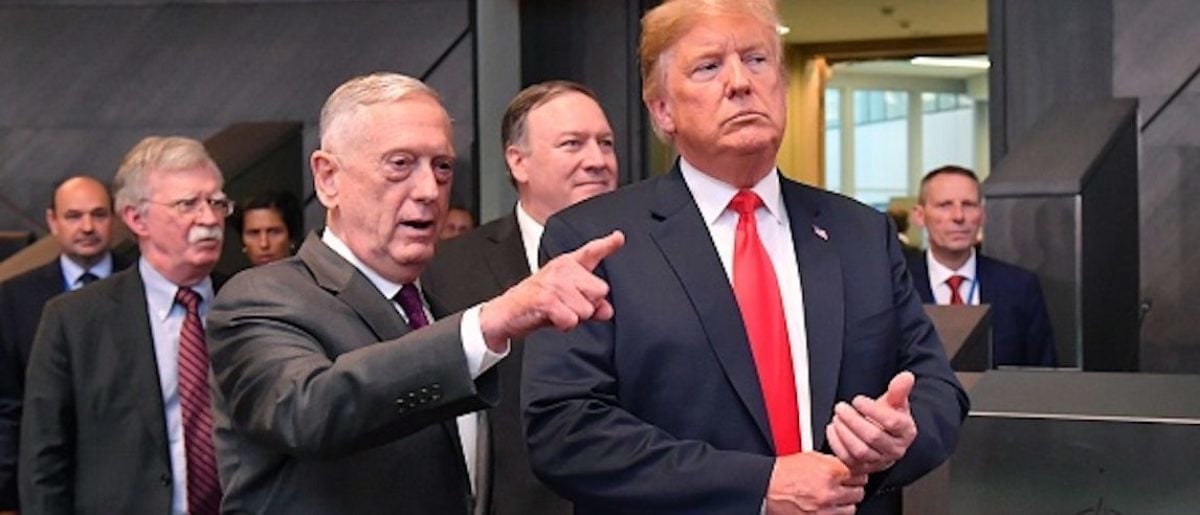 US President Donald Trump (C) walks with US Secretary of Defence James Mattis (3L), US Secretary of State Mike Pompeo (REAR) and US National Security Adviser National security adviser John Bolton (2L) after arriving to attend the North Atlantic Council meeting during the NATO (North Atlantic Treaty Organization) summit, at the NATO headquarters in Brussels, on July 11, 2018. (Photo by EMMANUEL DUNAND / AFP) (Photo credit should read EMMANUEL DUNAND/AFP/Getty Images)