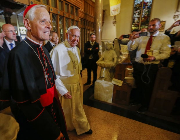 WASHINGTON, DC - SEPTEMBER 24: Pope Francis (R) arrives with Cardinal Donald Wuerl (L) to visit St. Patrick in the City Catholic church on September 24, 2015 in Washington, DC. St. Patrick is the oldest Catholic church in Washington, founded in 1794. Pope Francis is on a five-day trip to the USA, which includes stops in Washington DC, New York and Philadelphia, after a three-day stay in Cuba. (Photo by Erik S. Lesser-Pool/Getty Images)