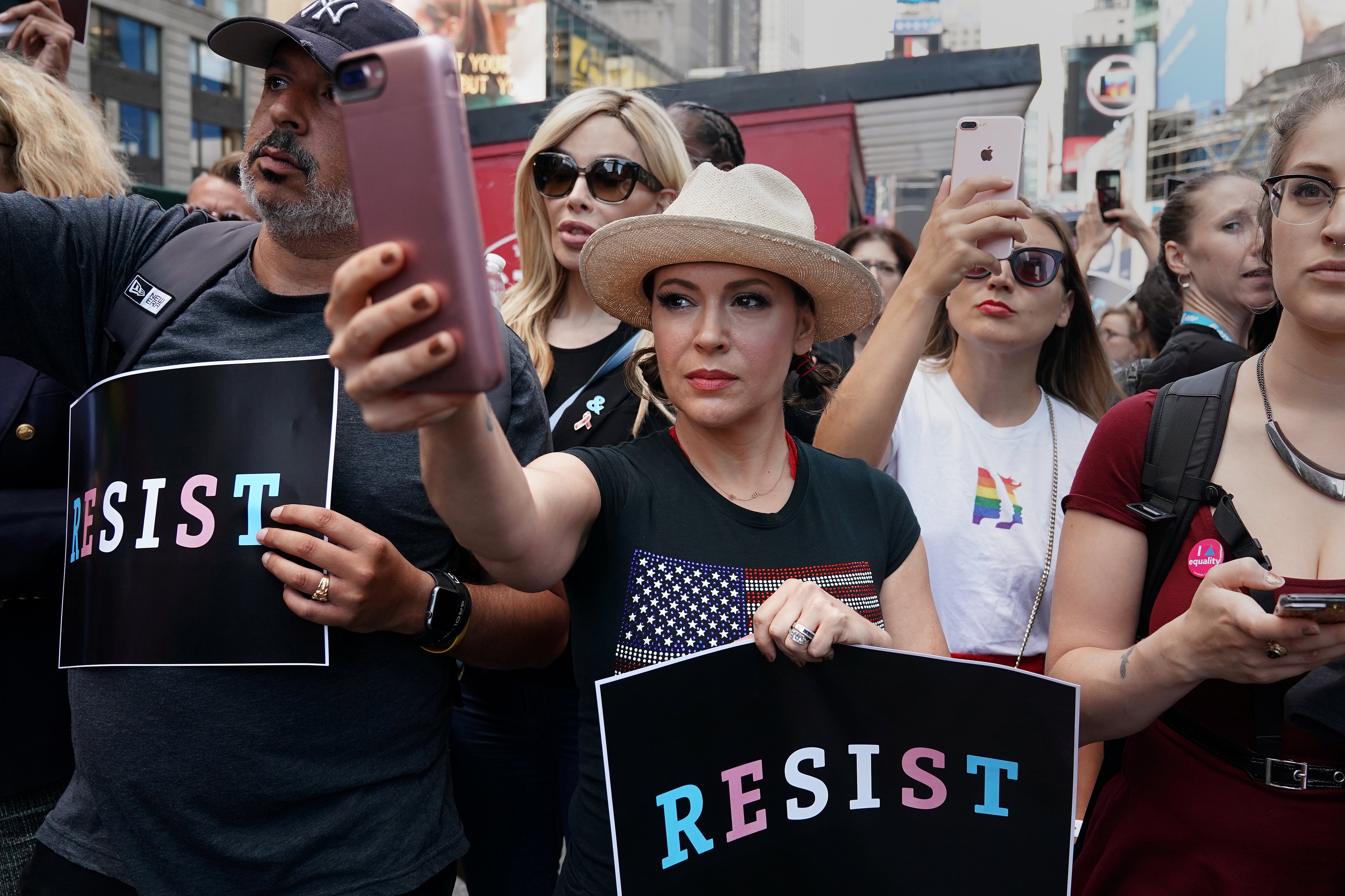 Actress Alyssa Milano attends a protest against U.S. President Donald Trump's announcement that he plans to reinstate a ban on transgender individuals from serving in any capacity in the U.S. military, in Times Square, in New York City, New York, U.S., July 26, 2017. REUTERS/Carlo Allegri