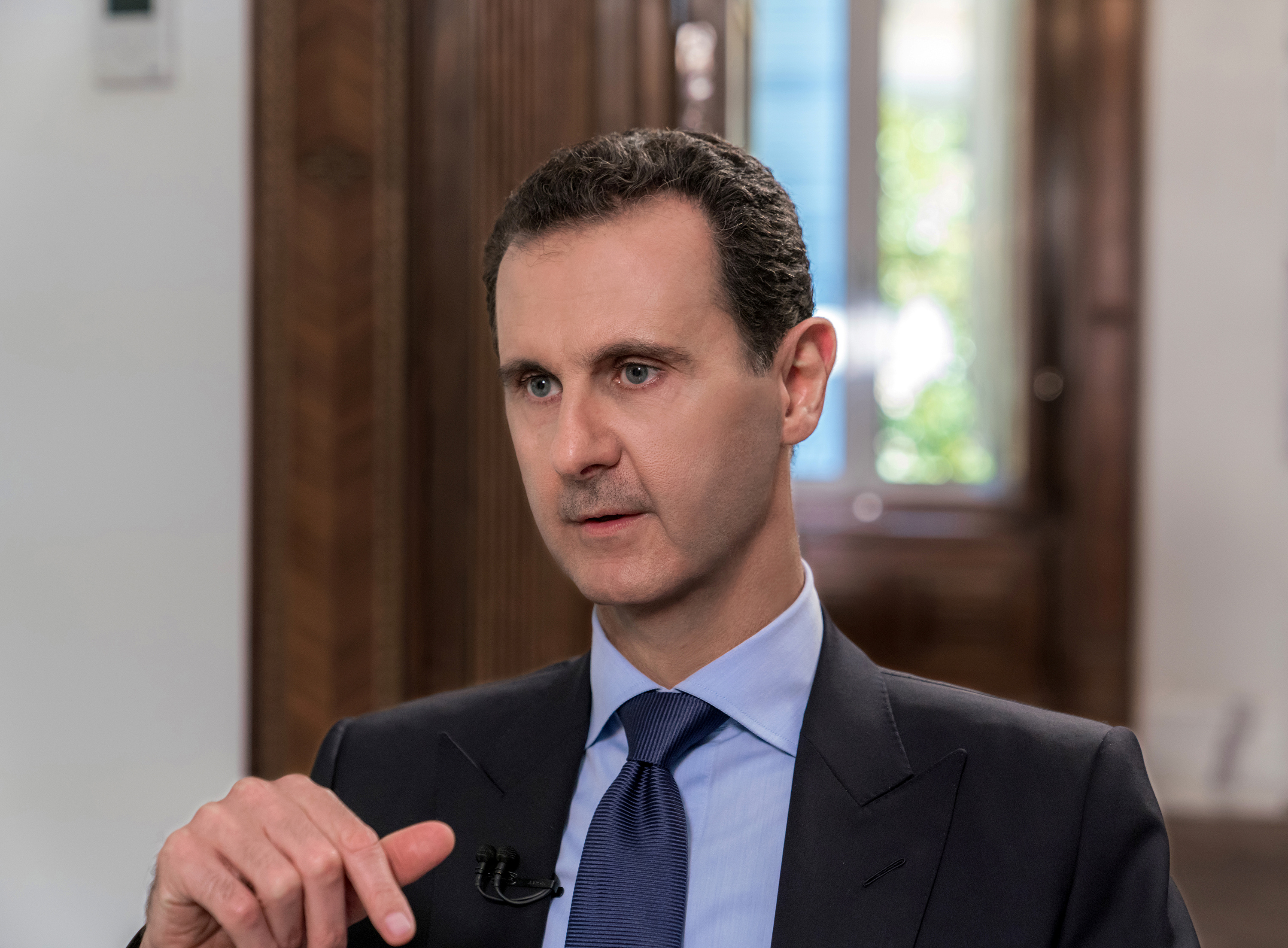 Syrian President Bashar al-Assad attends an interview with Russian television channel NTV, in Damascus, Syria in this handout released on June 24, 2018. SANA/Handout via REUTERS