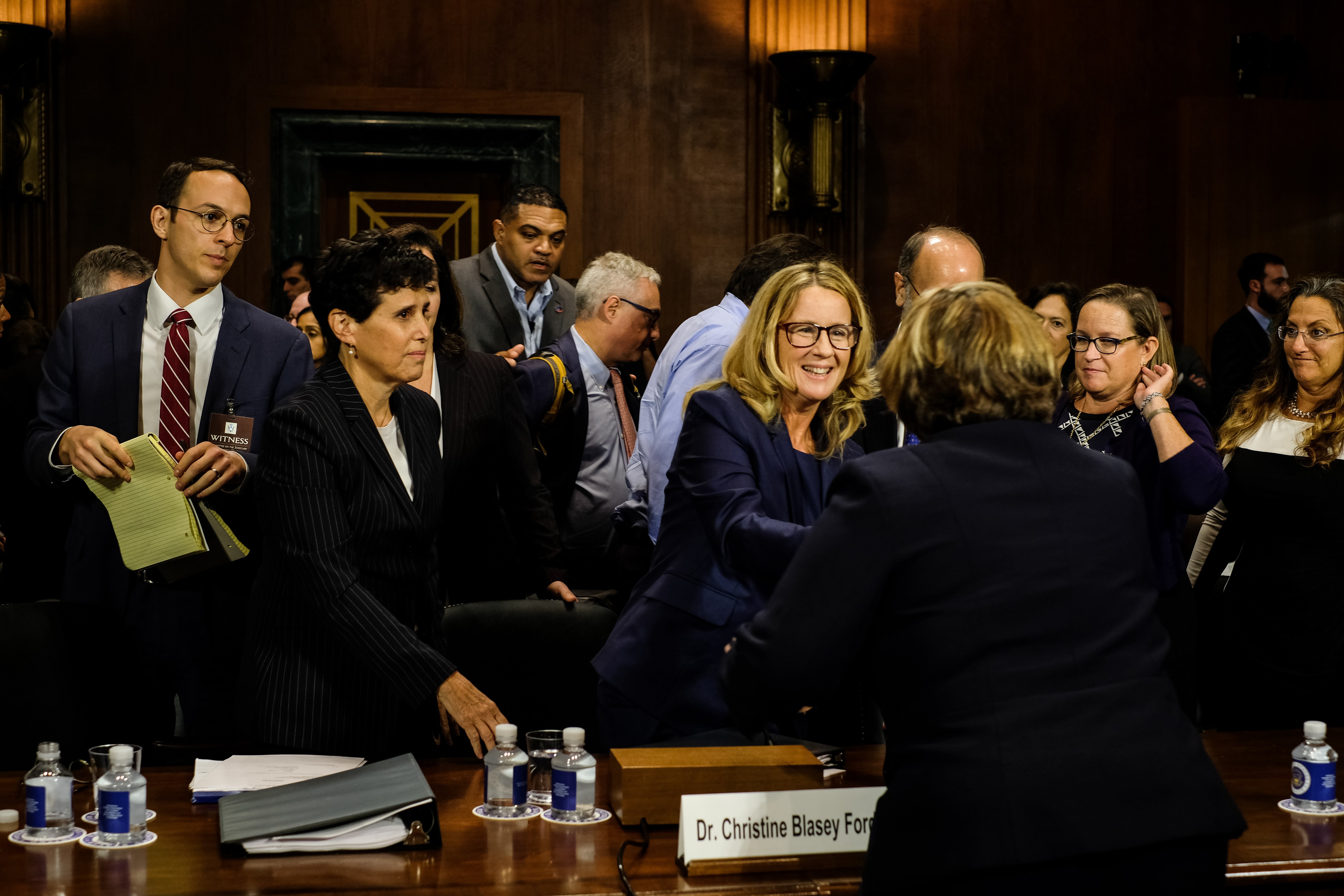 WASHINGTON, DC - SEPTEMBER 27: Christine Blasey Ford (C) shakes hands with Rachel Mitchell, chief of the Special Victims Division of the Maricopa County attorney's office in Arizona, who questioned Blasey Ford at a hearing of the U.S. Senate Judiciary Committee at the Dirksen Senate Office Building on Capitol Hill September 27, 2018 in Washington, DC. (Gabriella Demczuk-Pool/Getty Images)