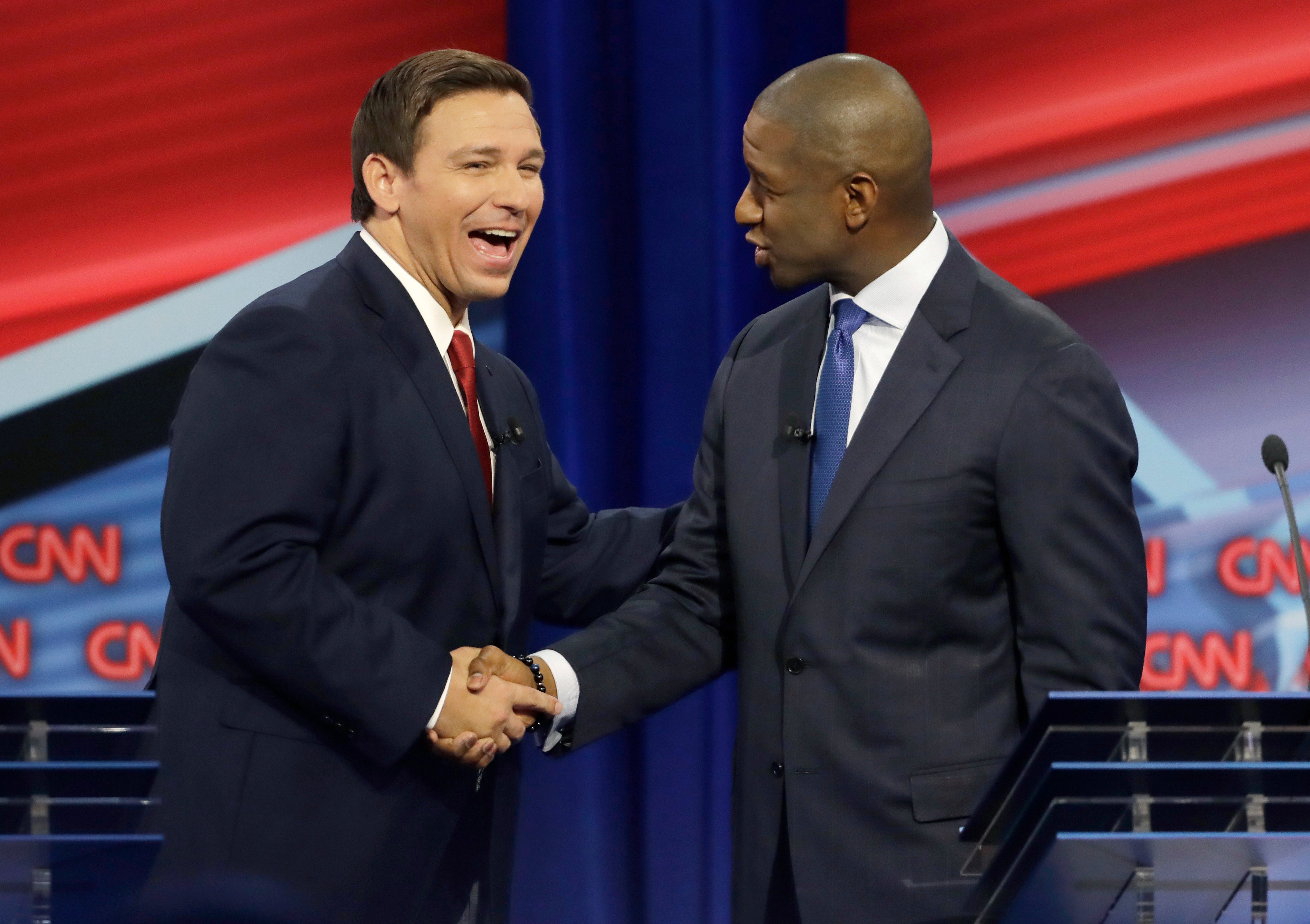 Florida Republican gubernatorial candidate Ron DeSantis, left, shakes hands with Democratic gubernatorial candidate Andrew Gillum after a CNN debate, Sunday, Oct. 21, 2018, in Tampa, Fla. (Chris O'Meara-Pool/Getty Images)