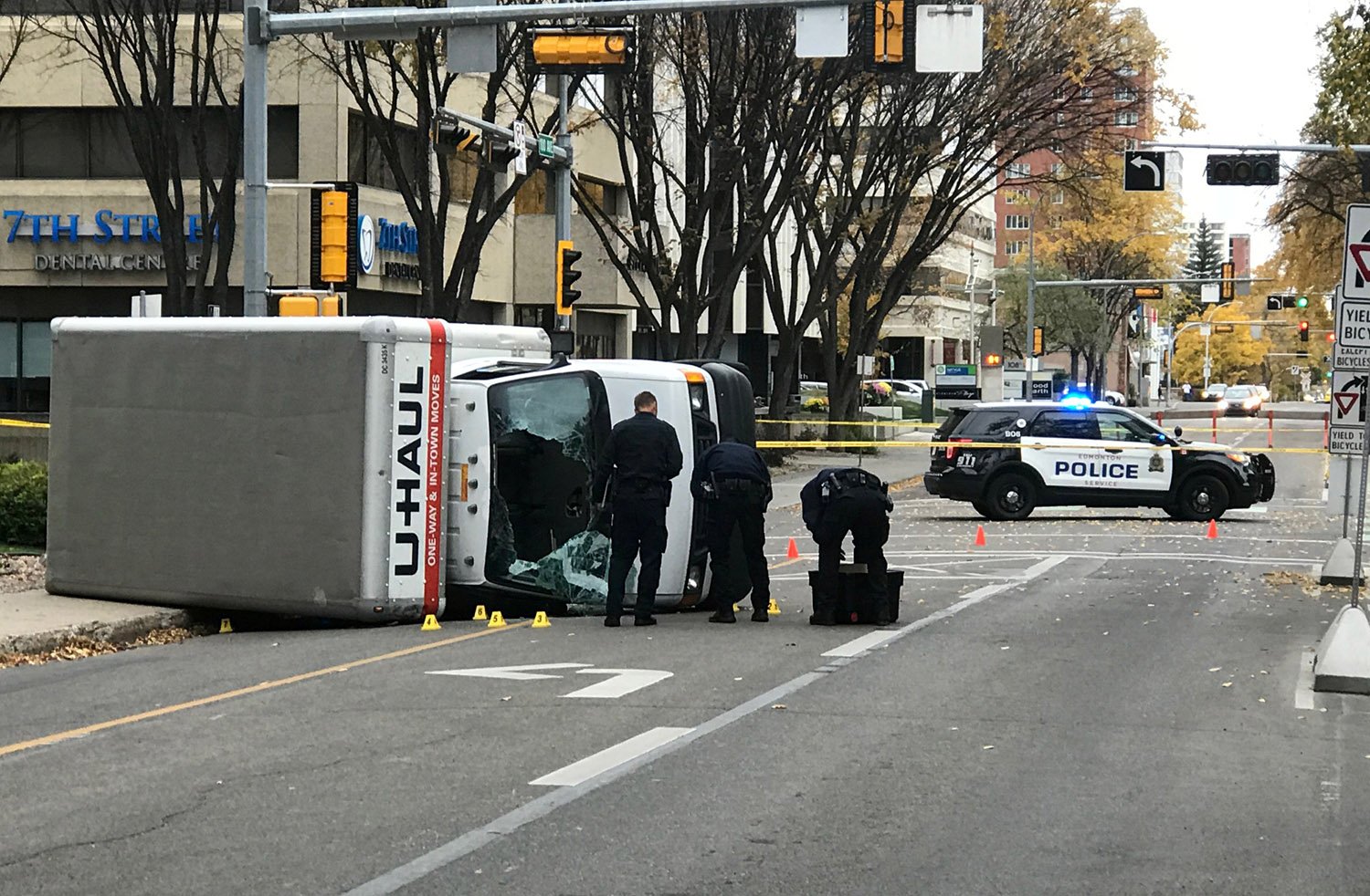 Edmonton Police investigate at the scene where a man hit pedestrians then flipped the U-Haul truck he was driving, pictured at the intersection at 107 Street and 100th Avenue in front of the Matrix Hotel in Edmonton, Alberta, Canada October 1, 2017. REUTERS/Candace Elliott