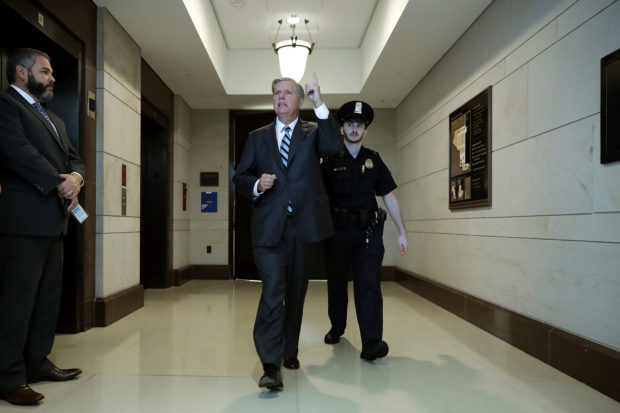 WASHINGTON, DC - OCTOBER 04: Senate Judiciary Committee member Sen. Lindsey Graham (R-SC) (C) leaves a secure meeting space inside the U.S. Capitol Visitors Center after reviewing the FBI report about alleged sexual assaults by Supreme Court nominee Judge Brett Kavanaugh October 04, 2018 in Washington, DC. Kavanaugh's confirmation process was halted for less than a week so that FBI investigators could look into allegations by Dr. Christine Blasey Ford, a California professor who has accused Kavanaugh of sexually assaulting her during a party in 1982 when they were high school students in suburban Maryland. (Photo by Chip Somodevilla/Getty Images)