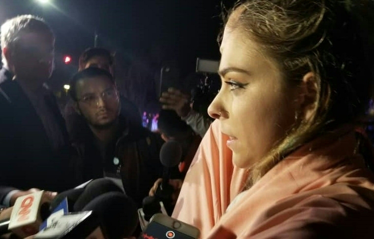 A witness talks to reporters outside a country music bar and dance hall in Thousand Oaks, west of Los Angeles, after a gunman barged into a large, crowded venue and opened fire late November 07, 2018, killing at least 11 people including a police officer, US police said. JAVIER TOVAR/AFP/Getty Images