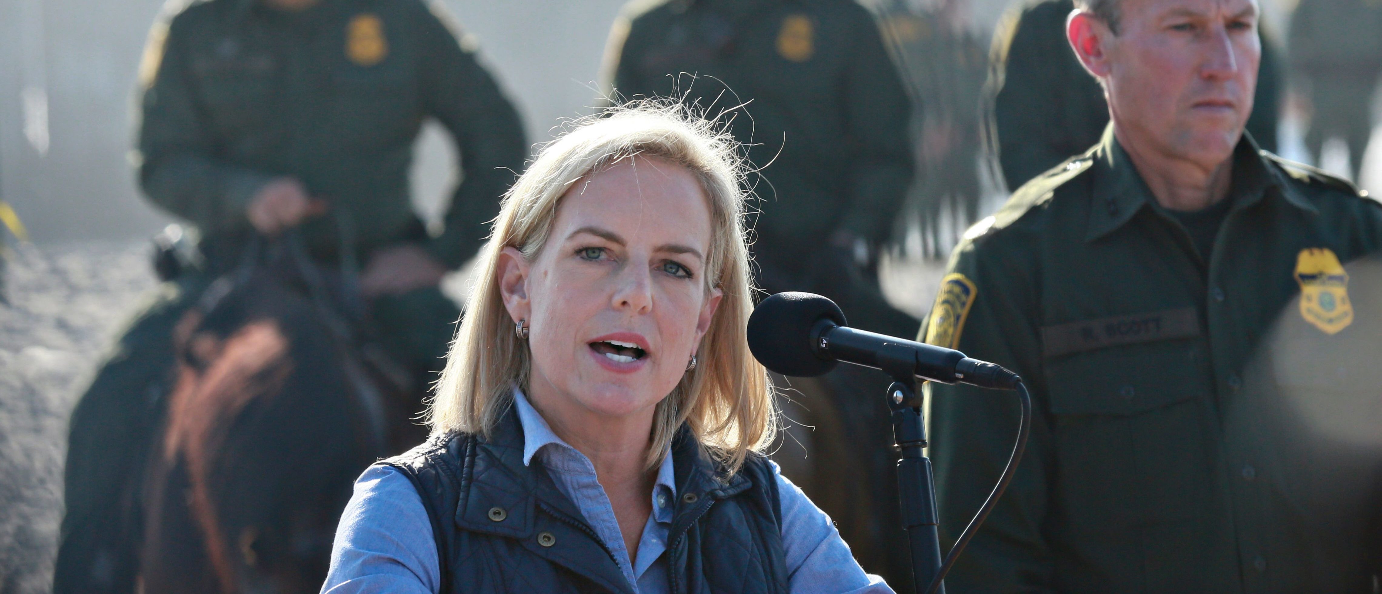 Kirstjen M. Nielsen, Secretary of the Department of Homeland Security, speaks to reporters during a press conference at Borderfield State Park along the United States-Mexico Border fence in San Ysidro, California on November 20, 2018. - A US federal judge temporarily blocked Donald Trump's administration from denying asylum to people who enter the country illegally, prompting the president to allege Tuesday that the court was biased against him. (Photo by Sandy Huffaker / AFP) (Photo credit should read SANDY HUFFAKER/AFP/Getty Images)
