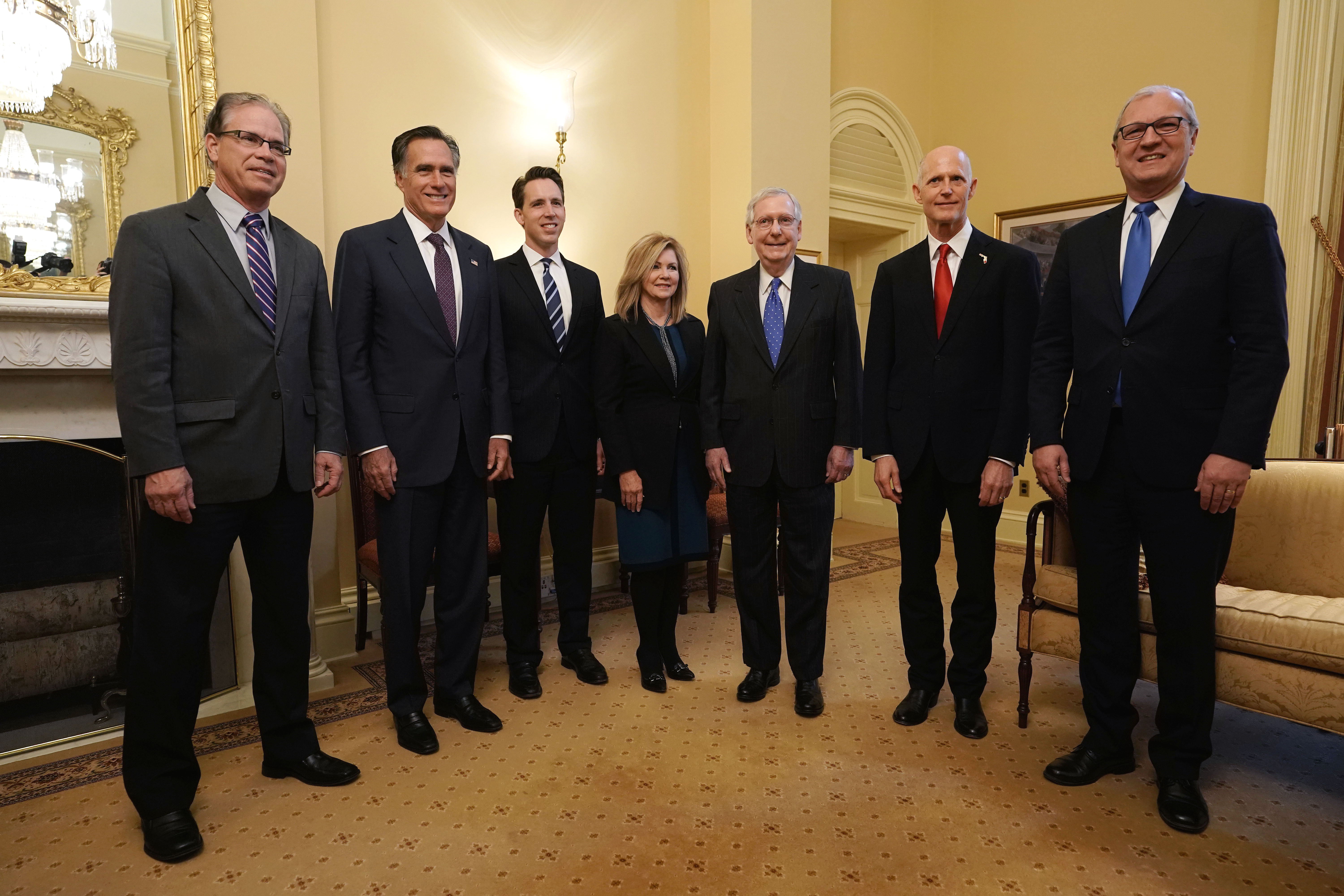 U.S. Senate Majority Leader Sen. Mitch McConnell (R-KY) (5th L) poses for photos with Republican Senator-elects Mike Braun of Indiana (L), Mitt Romney of Utah (2nd L), Josh Hawley of Missouri (3rd L), Marsha Blackburn of Tennessee (4th L), Kevin Cramer of North Dakota (R) and Republican U.S. Senate candidate for Florida and incumbent Florida Gov. Rick Scott (6th L) during a photo-op at the U.S. Capitol November 14, 2018 in Washington, DC. Alex Wong/Getty Images