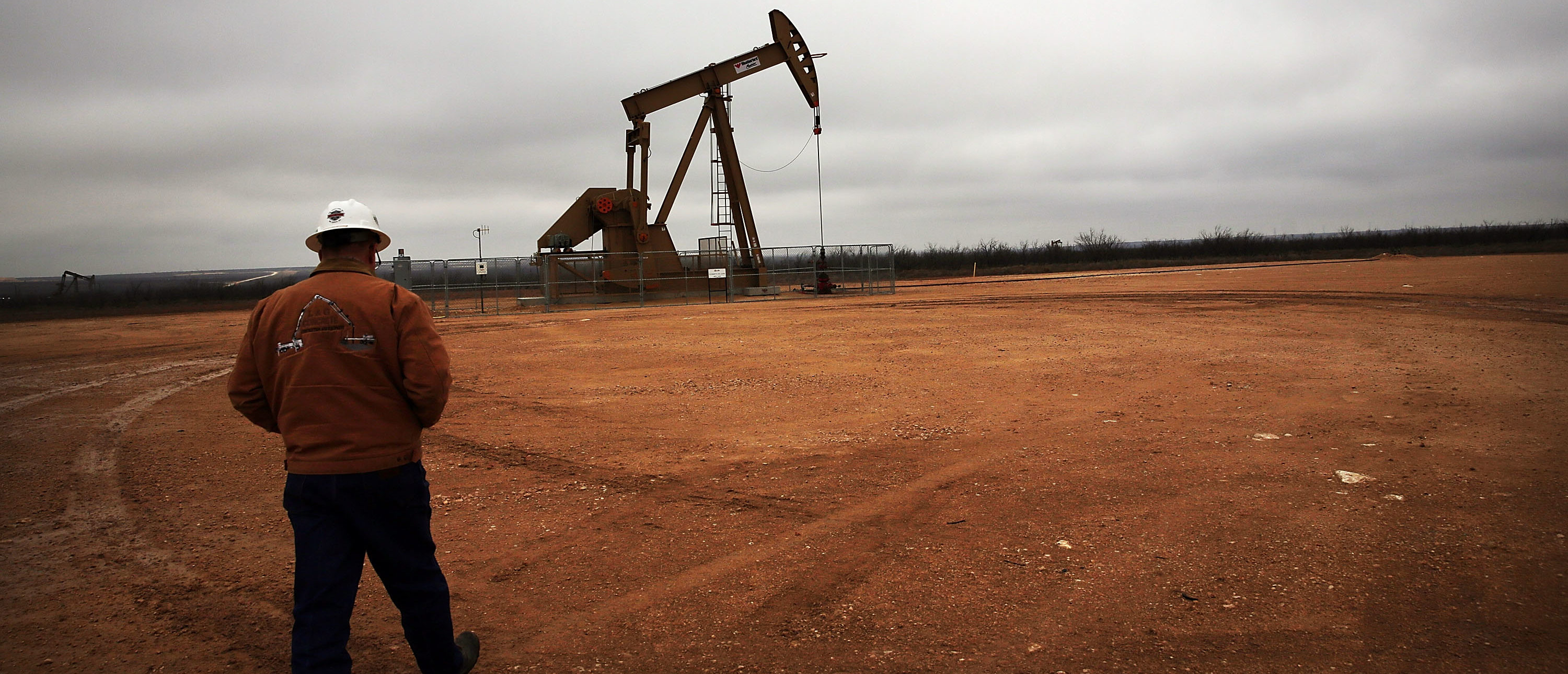 GARDEN CITY, TX - FEBRUARY 05: An oil well owned an operated by Apache Corporation in the Permian Basin are viewed on February 5, 2015 in Garden City, Texas. The well produces about 55-70 barrels of oil per day. As crude oil prices have fallen nearly 60 percent globally, many American communities that became dependent on oil revenue are preparing for hard times. Texas, which benefited from hydraulic fracturing and the shale drilling revolution, tripled its production of oil in the last five years. The Texan economy saw hundreds of billions of dollars come into the state before the global plunge in prices. Across the state drilling budgets are being slashed and companies are notifying workers of upcoming layoffs. According to federal labor statistics, around 300,000 people work in the Texas oil and gas industry, 50 percent more than four years ago. (Photo by Spencer Platt/Getty Images)
