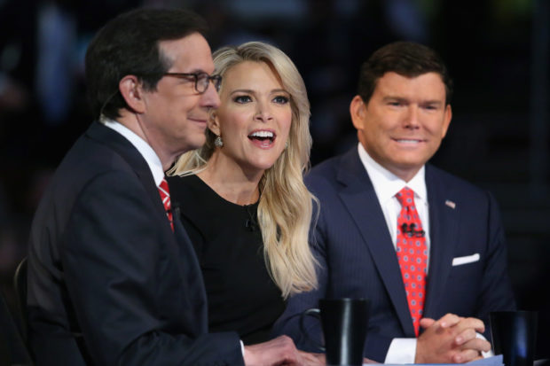 CLEVELAND, OH - AUGUST 06: FOX News anchors (L-R) Chris Wallace, Megyn Kelly and Bret Baier moderate the first prime-time Republican presidential debate hosted at the Quicken Loans Arena August 6, 2015 in Cleveland, Ohio. The top-ten GOP candidates were selected to participate in the debate based on their rank in an average of the five most recent national political polls. (Photo by Chip Somodevilla/Getty Images)