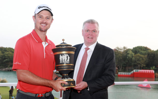 SHANGHAI, CHINA - OCTOBER 29: Justin Rose of England celebrates with the Old Tom Morris Cup and Noel Quinn, Chief Executive of Global Commercial Banking, after finishing 14 under to win the WGC - HSBC Champions at Sheshan International Golf Club on October 29, 2017 in Shanghai, China. (Photo by Scott Halleran/Getty Images)