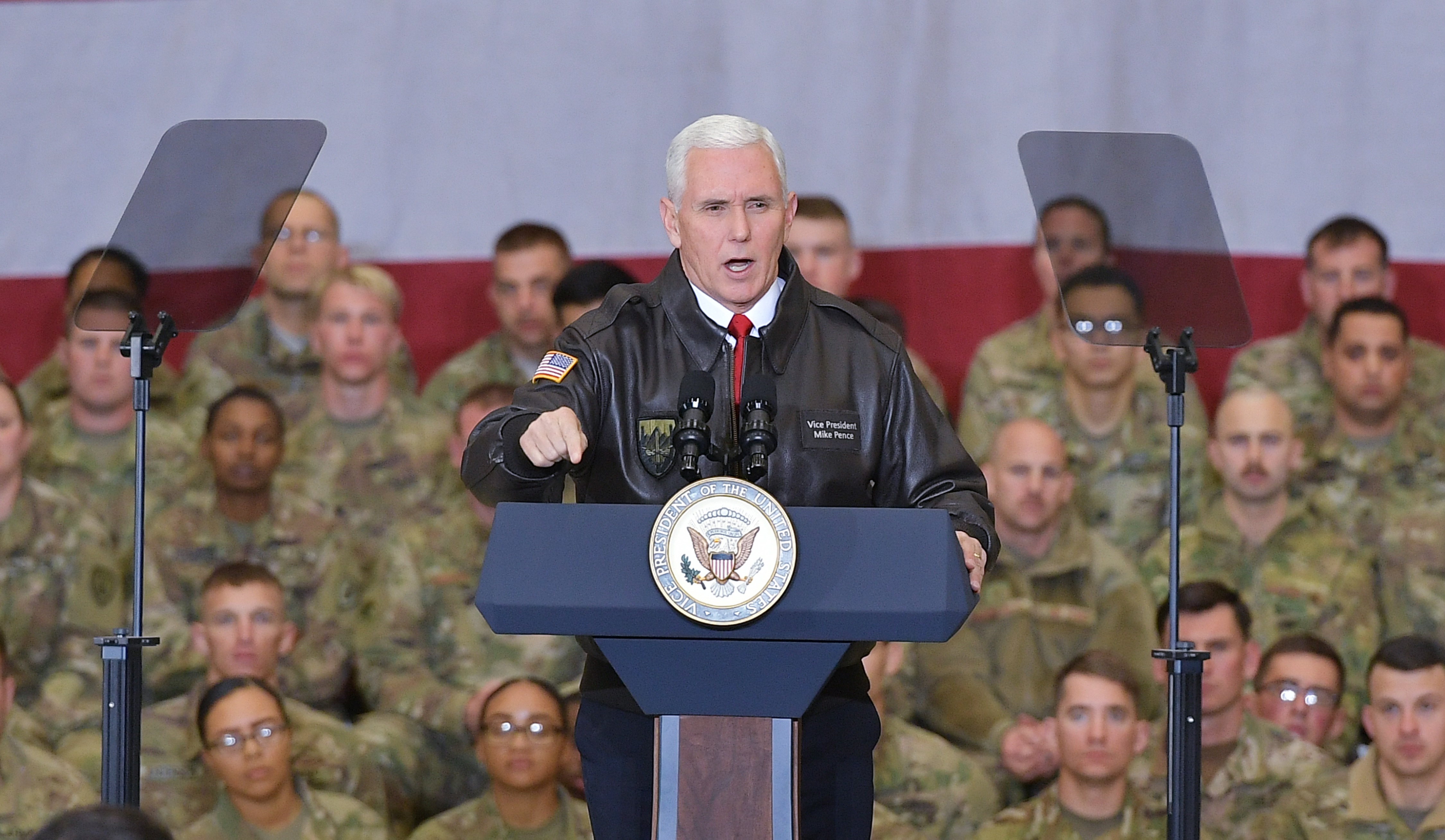 US Vice President Mike Pence speaks to troops in a hangar at Bagram Air Field in Afghanistan on December 21, 2017. POOL / AFP PHOTO / POOL / Mandel NGAN 