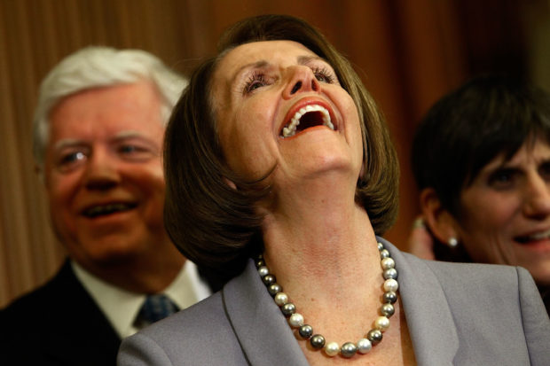 WASHINGTON - MARCH 22: Speaker of the House Nancy Pelosi (D-CA) (C) has a laugh during a news conference after the House passed health care reform legislation at the U.S. Capitol March 22, 2010 in Washington, DC. The House passed the Senate's version of the health care bill by a vote of 220-211 and without a single Republican vote. (Photo by Chip Somodevilla/Getty Images)