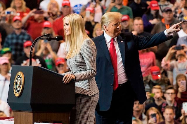 US President Donald Trump gestures as his daughter Ivanka Trump speaks at a Make America Great Again rally in Cleveland, Ohio on November 5, 2018. (Photo by Jim WATSON / AFP) (Photo credit:JIM WATSON/AFP/Getty Images)