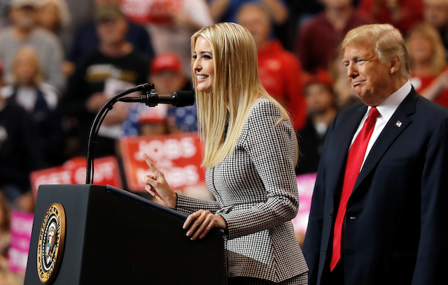U.S. President Donald Trump listens as his daughter, White House senior adviser Ivanka Trump, speaks during a campaign rally on the eve of the U.S. midterm election in Cleveland, Ohio, U.S., November 5, 2018. REUTERS/Carlos Barria