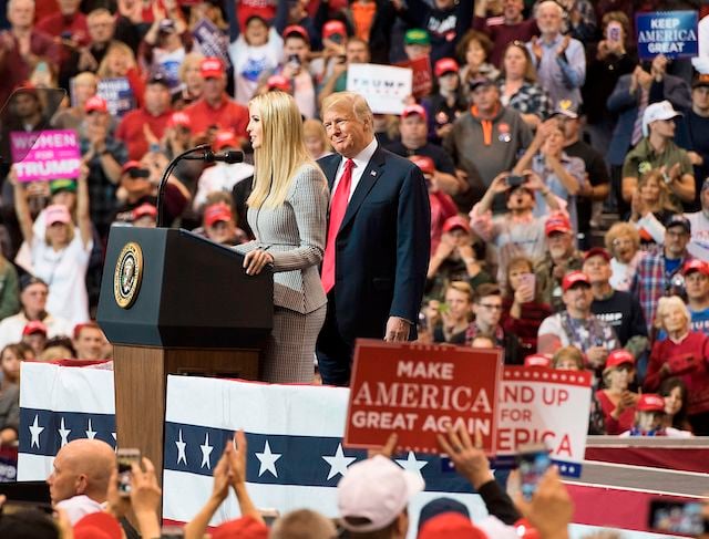 US President Donald Trump looks on as his daughter Ivanka Trump speaks at a Make America Great Again rally in Cleveland, Ohio on November 5, 2018. (Photo by Jim WATSON / AFP) (Photo credit: JIM WATSON/AFP/Getty Images)
