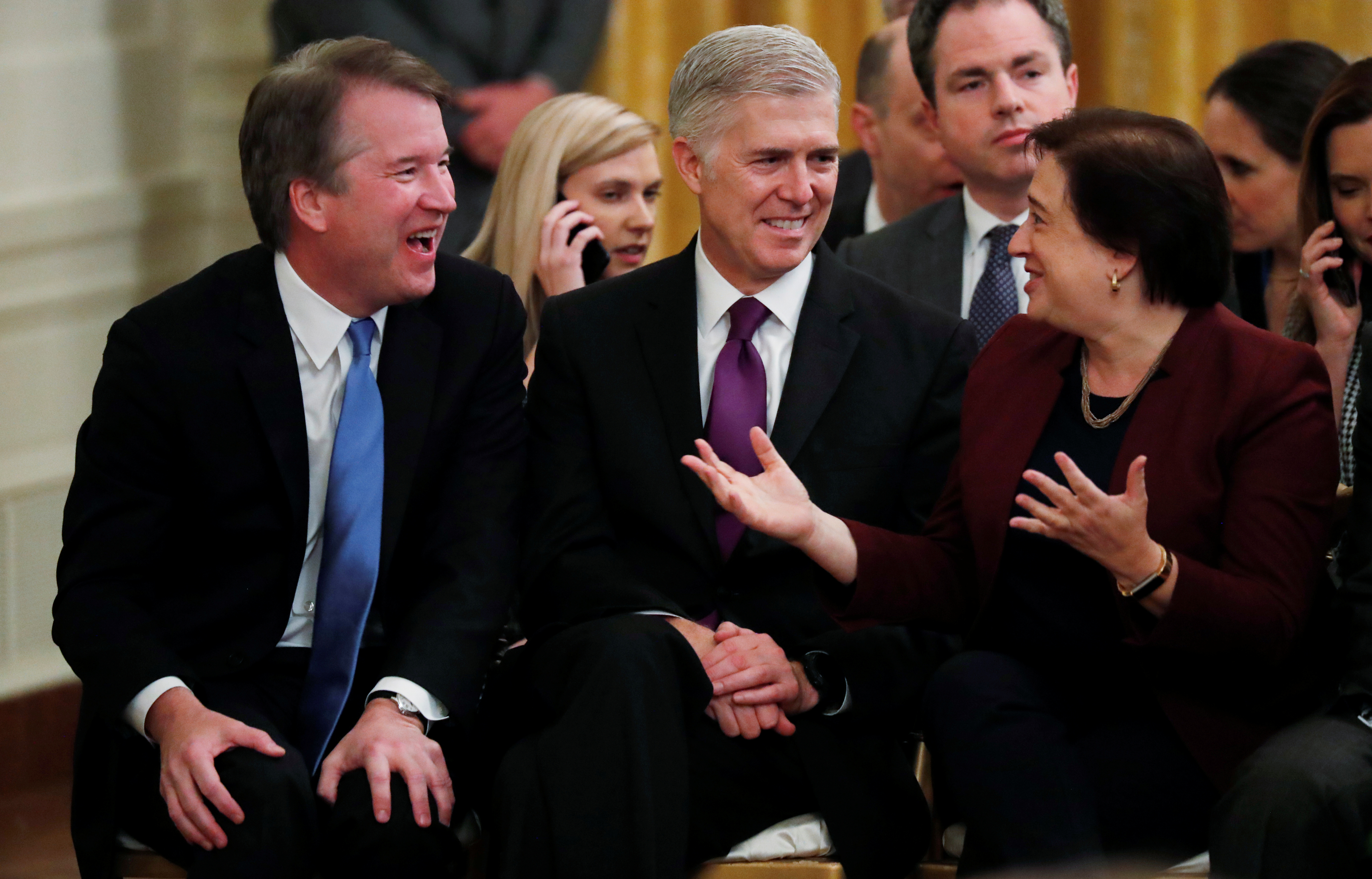 Justices Brett Kavanaugh, Neil Gorsuch and Elena Kagan talk as they attend a ceremony where President Donald Trump awarded the 2018 Presidential Medals of Freedom in the East Room of the White House. November 16, 2018. REUTERS/Jonathan Ernst