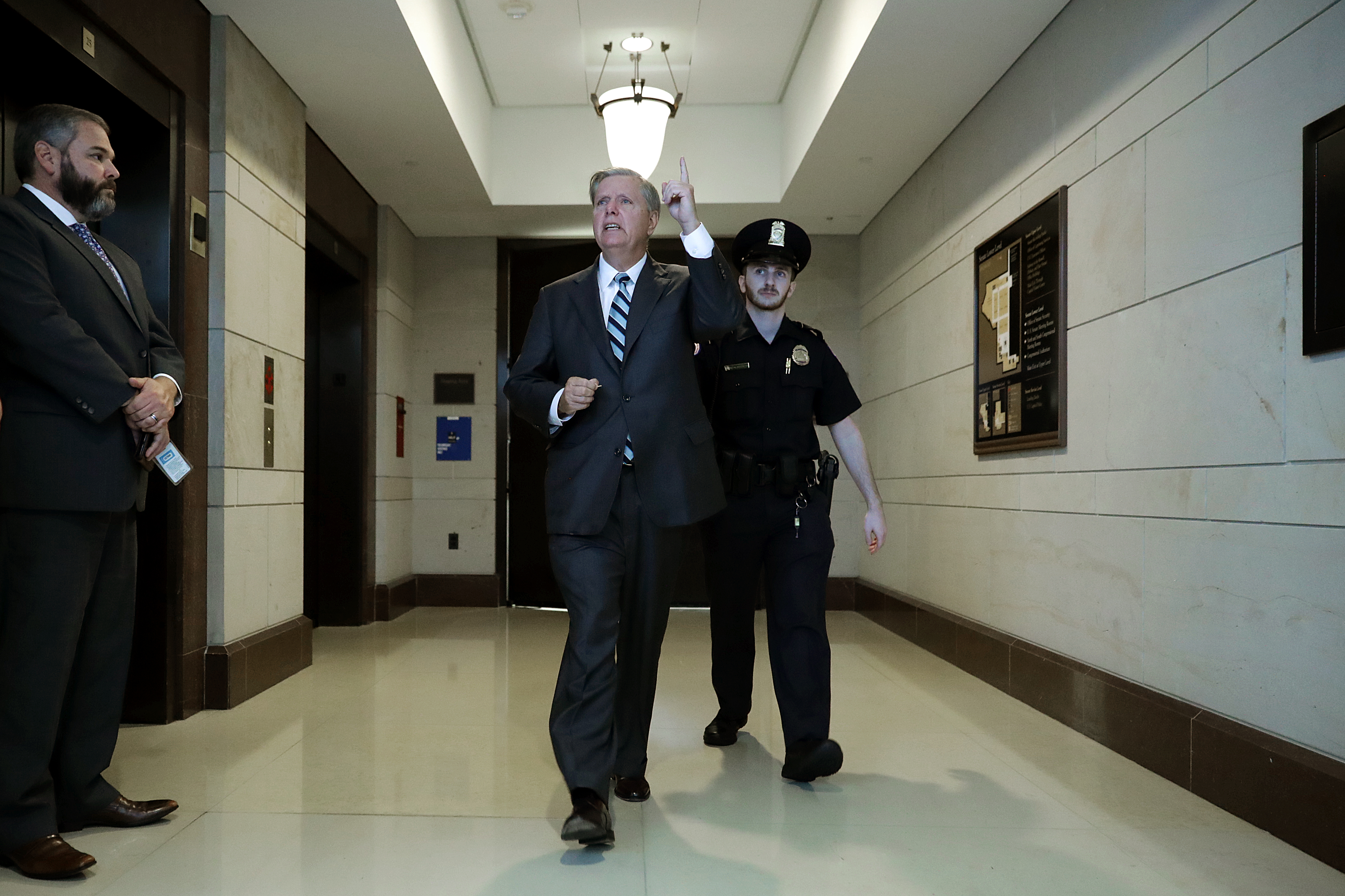 Senate Judiciary Committee member Sen. Lindsey Graham (R-SC) (C) leaves a secure meeting space inside the U.S. Capitol Visitors Center after reviewing the FBI report about alleged sexual assaults by Supreme Court nominee Judge Brett Kavanaugh (Chip Somodevilla/Getty Images)