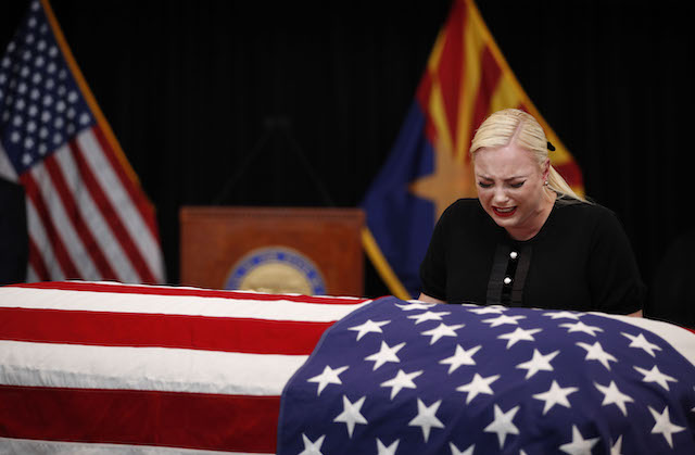 Meghan McCain, daughter of Sen. John McCain, touches the casket during a memorial service at the Arizona Capitol on August 29, 2018, in Phoenix, Arizona. John McCain will lie in state at the Arizona State Capitol before being transported to Washington D.C. where he will be buried at the U.S. Naval Academy Cemetery in Annapolis. Sen. McCain, a decorated war hero, died August 25 at the age of 81 after a long battle with Glioblastoma, a form of brain cancer. (Photo by Jae C. Hong - Pool/Getty Images)