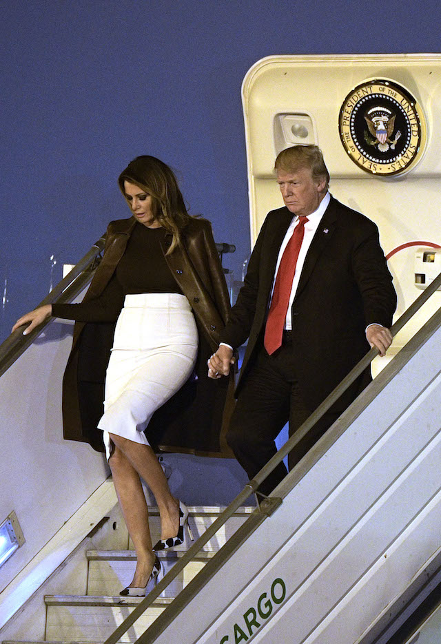 US President Donald Trump (R) and US First Lady Melania Trump, disembark from Air Force One upon arrival at Ezeiza International airport in Buenos Aires province, on November 29, 2018, on the eve of the G20 Leaders' Summit. - US President Donald Trump jets into Argentina on Thursday for a G20 summit, keen to do battle with China on trade and sharpening his rhetoric against Russia over Ukraine. (Photo credit: JUAN MABROMATA/AFP/Getty Images)